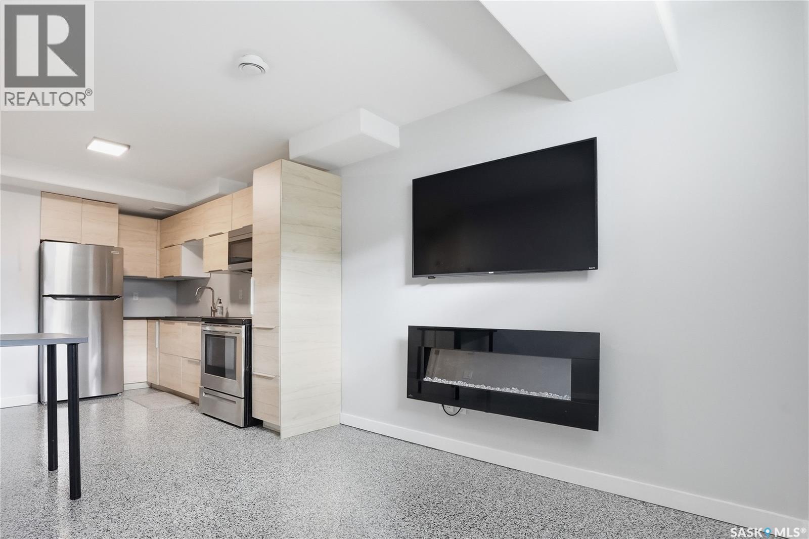 246 Aniskotaw Manor, Saskatoon, SK - Indoor With Fireplace