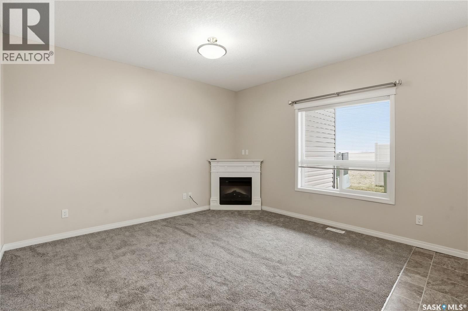 210 3818 Dewdney Avenue E, Regina, SK - Indoor With Fireplace