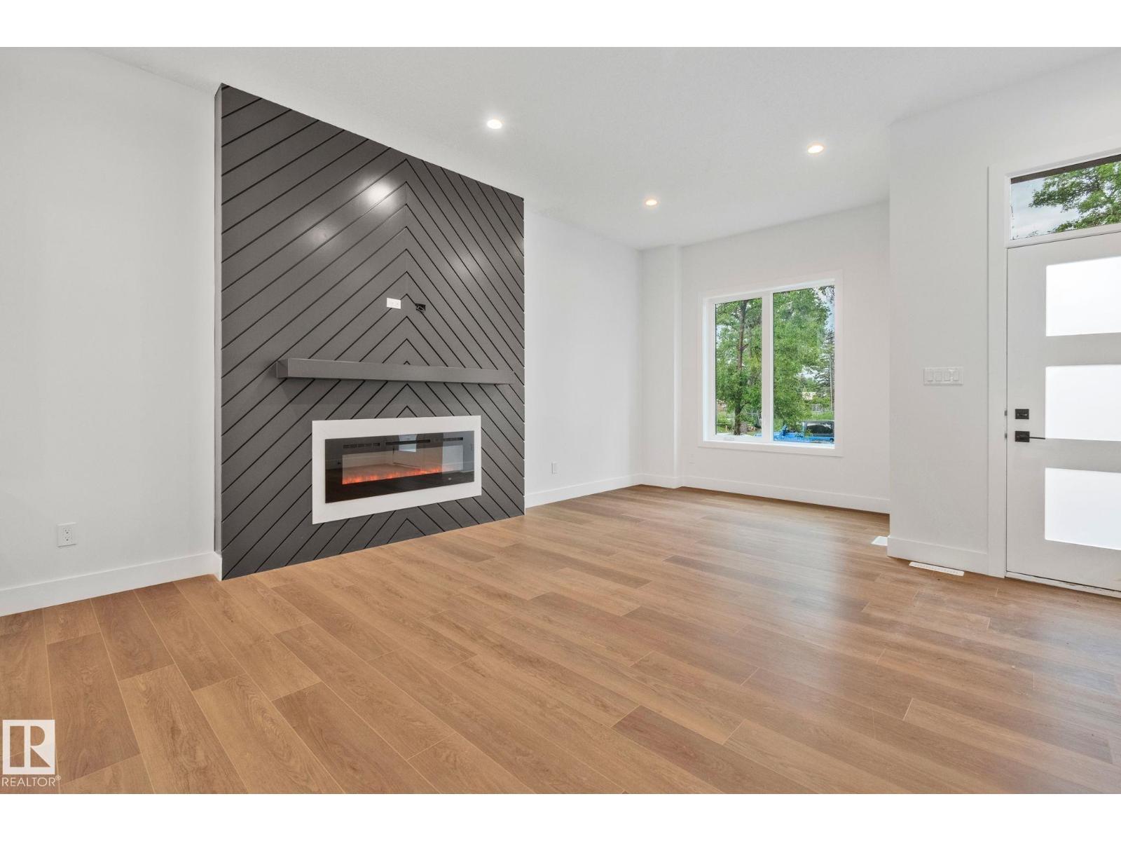 11036 128 St Nw, Edmonton, AB - Indoor Photo Showing Living Room With Fireplace