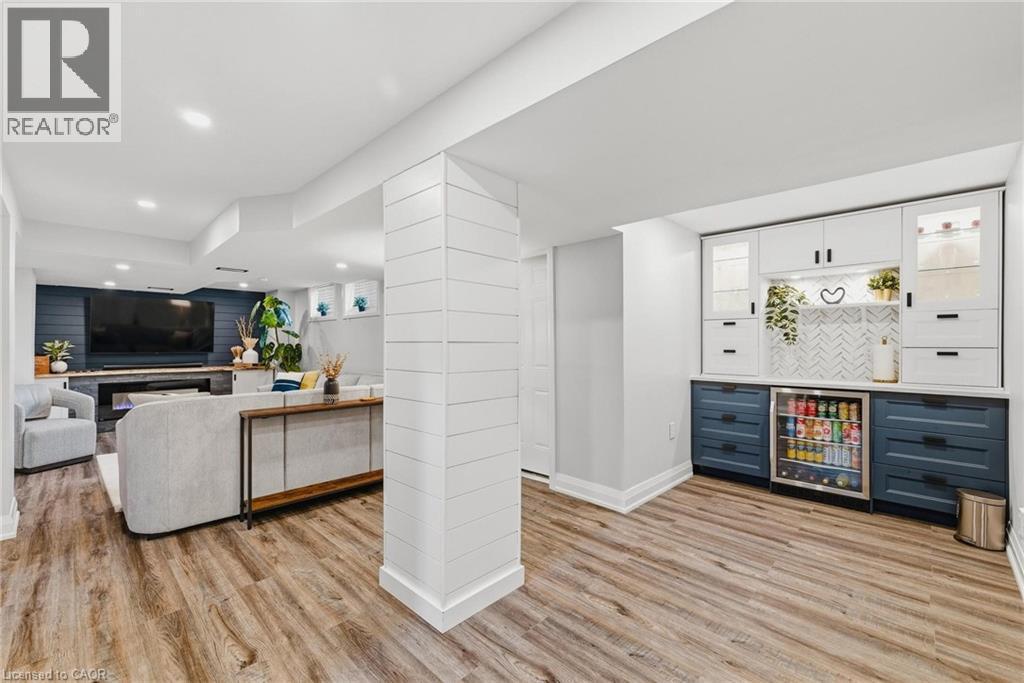 Finished lower level featuring wood-finish flooring and recessed lighting - 120 Elgin Crescent, Waterloo, ON - Indoor