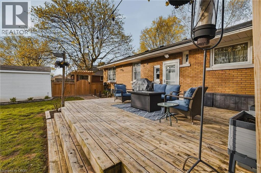Expansive backyard wood deck with multiple levels and a brick exterior - 120 Elgin Crescent, Waterloo, ON - Outdoor With Deck Patio Veranda With Exterior