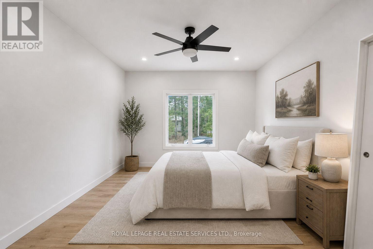 99 Tall Pines Drive, Tiny, ON - Indoor Photo Showing Bedroom