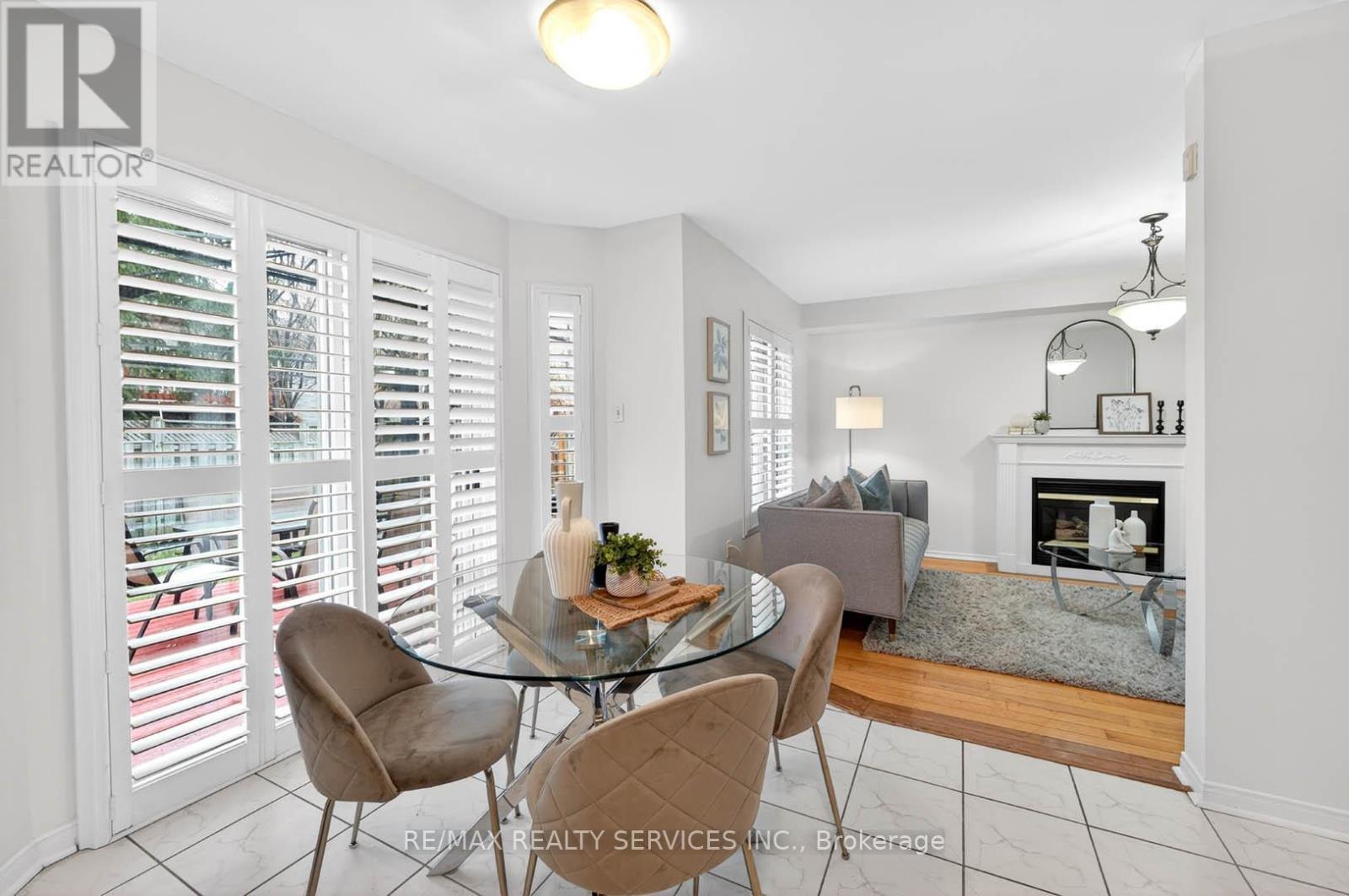 6 Creekwood Drive, Brampton, ON - Indoor Photo Showing Dining Room With Fireplace