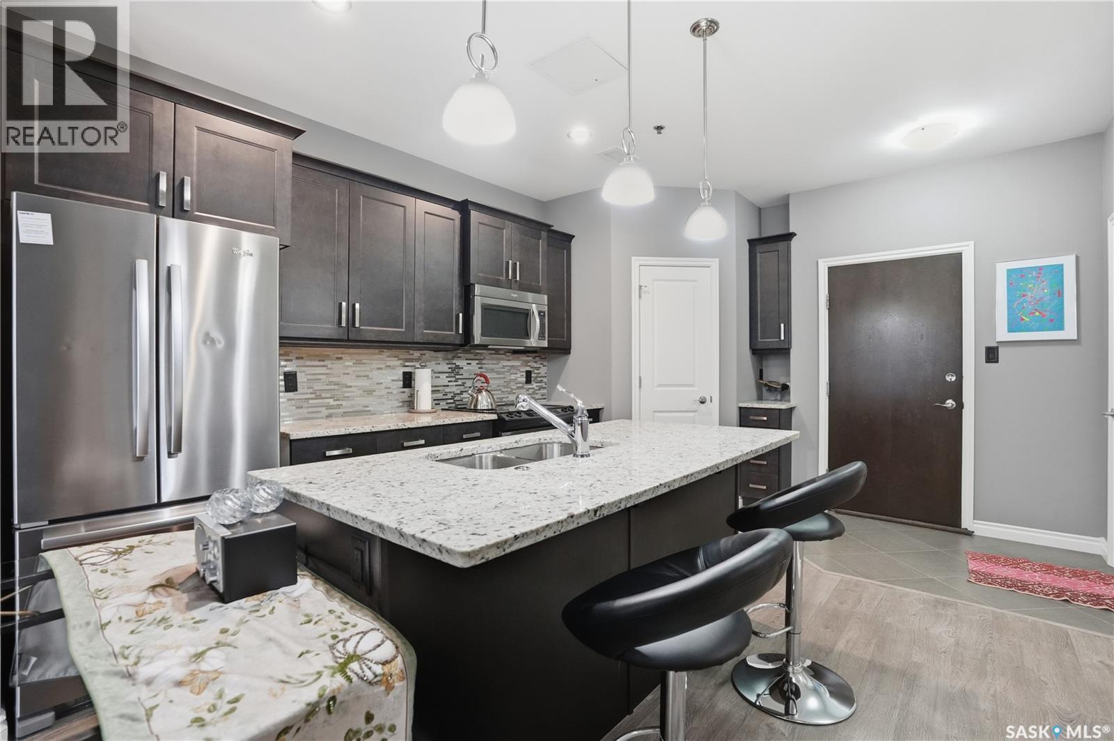 104 4891 Trinity Lane, Regina, SK - Indoor Photo Showing Kitchen With Double Sink With Upgraded Kitchen