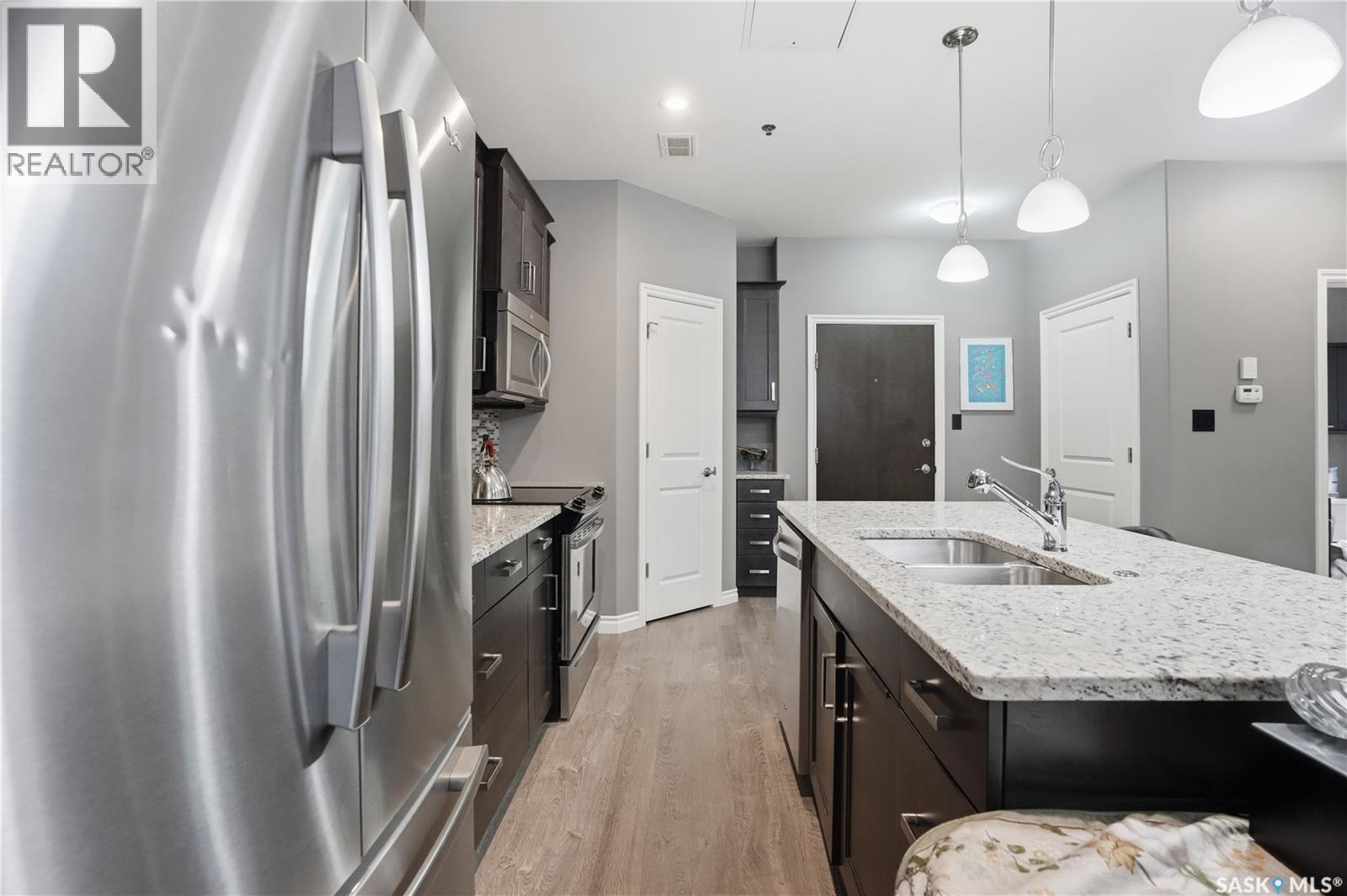 104 4891 Trinity Lane, Regina, SK - Indoor Photo Showing Kitchen With Double Sink With Upgraded Kitchen