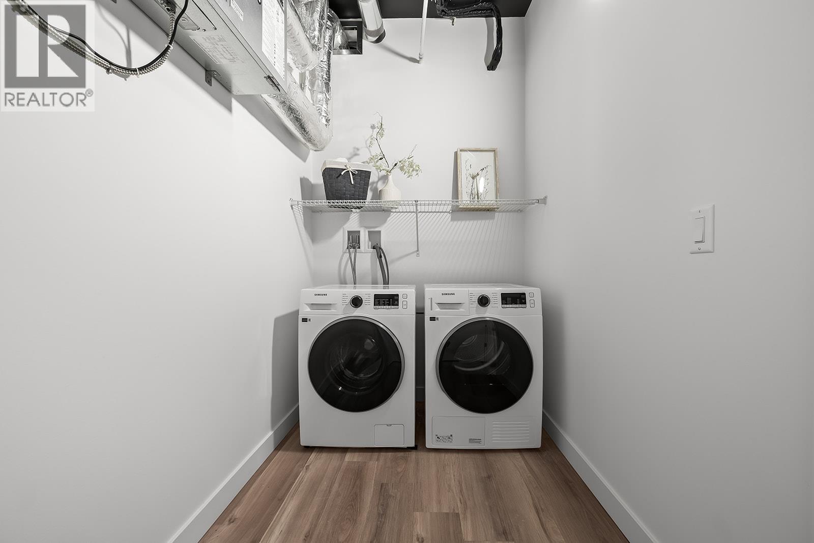 Laundry. Photos may be of a similar home in the community. - 1111 Frost Road Unit# 202, Kelowna, BC - Indoor Photo Showing Laundry Room