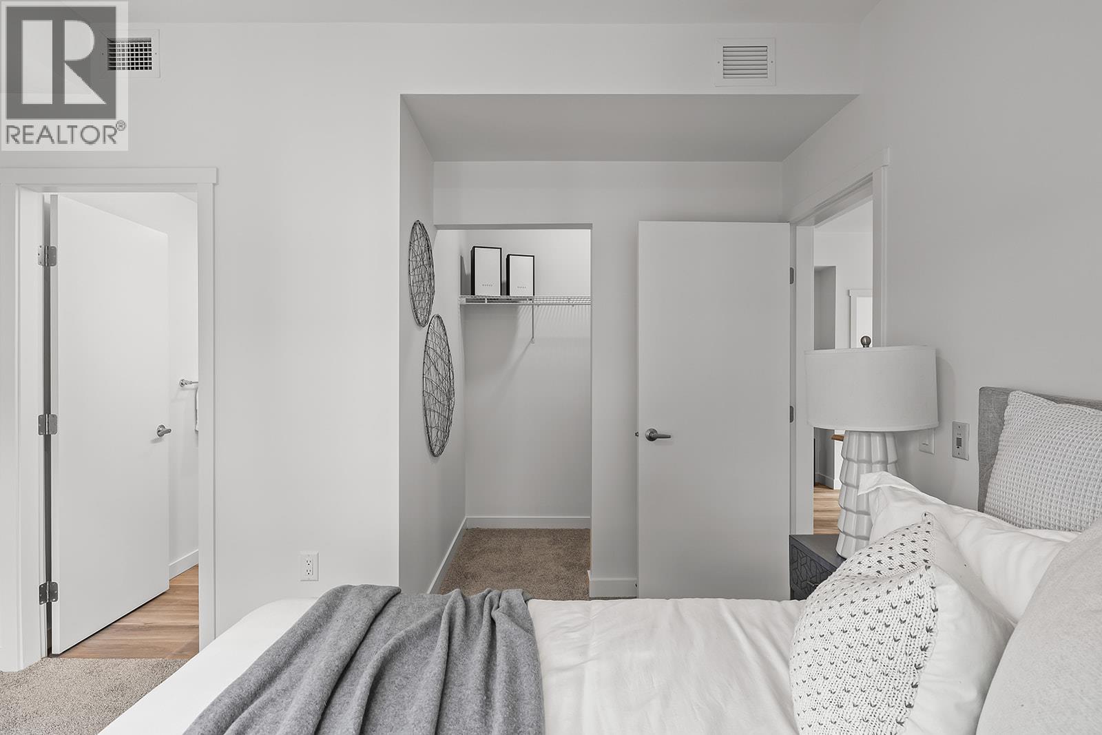 Primary Bedroom. Photos may be of a similar home in the community. - 1111 Frost Road Unit# 202, Kelowna, BC - Indoor Photo Showing Bedroom