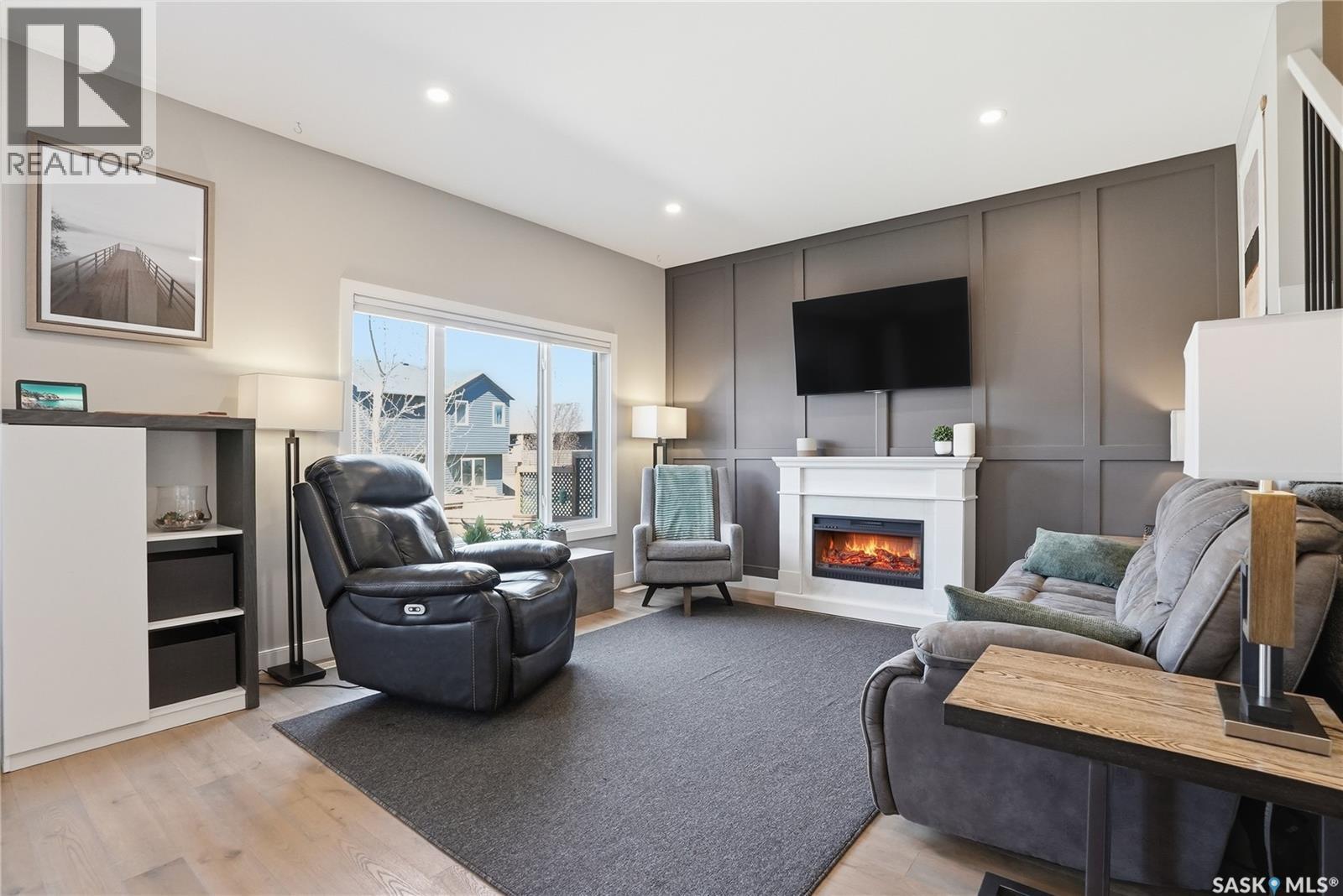 331 Underhill Bend, Saskatoon, SK - Indoor Photo Showing Living Room With Fireplace