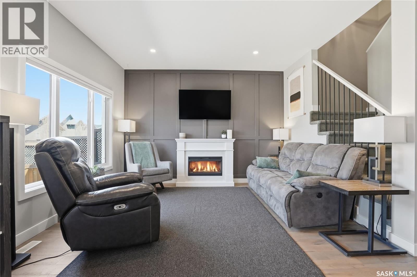 331 Underhill Bend, Saskatoon, SK - Indoor Photo Showing Living Room With Fireplace
