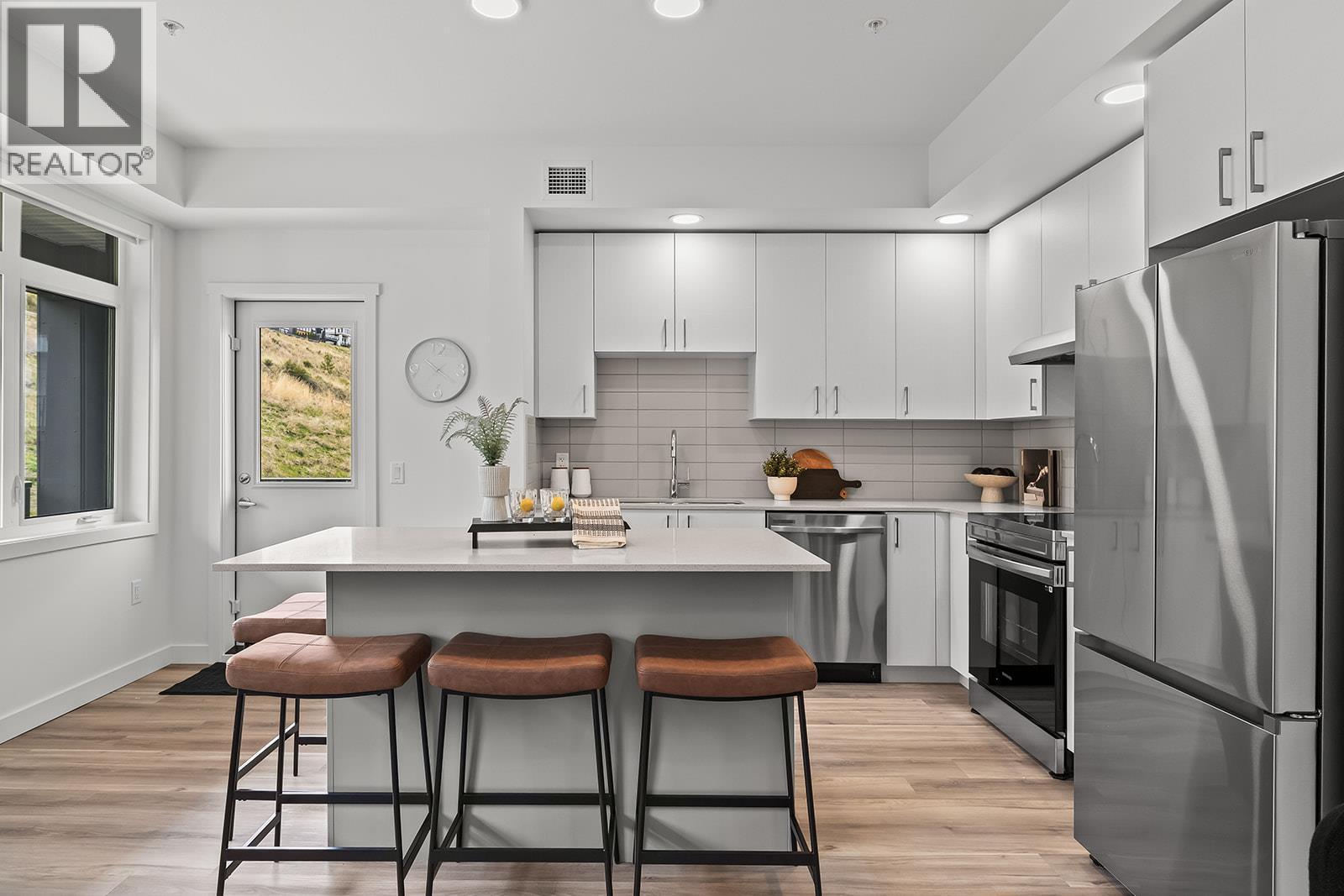 Kitchen. Photos may be of a similar home in the community. - 1057 Frost Road Unit# 418, Kelowna, BC - Indoor Photo Showing Kitchen With Stainless Steel Kitchen With Upgraded Kitchen