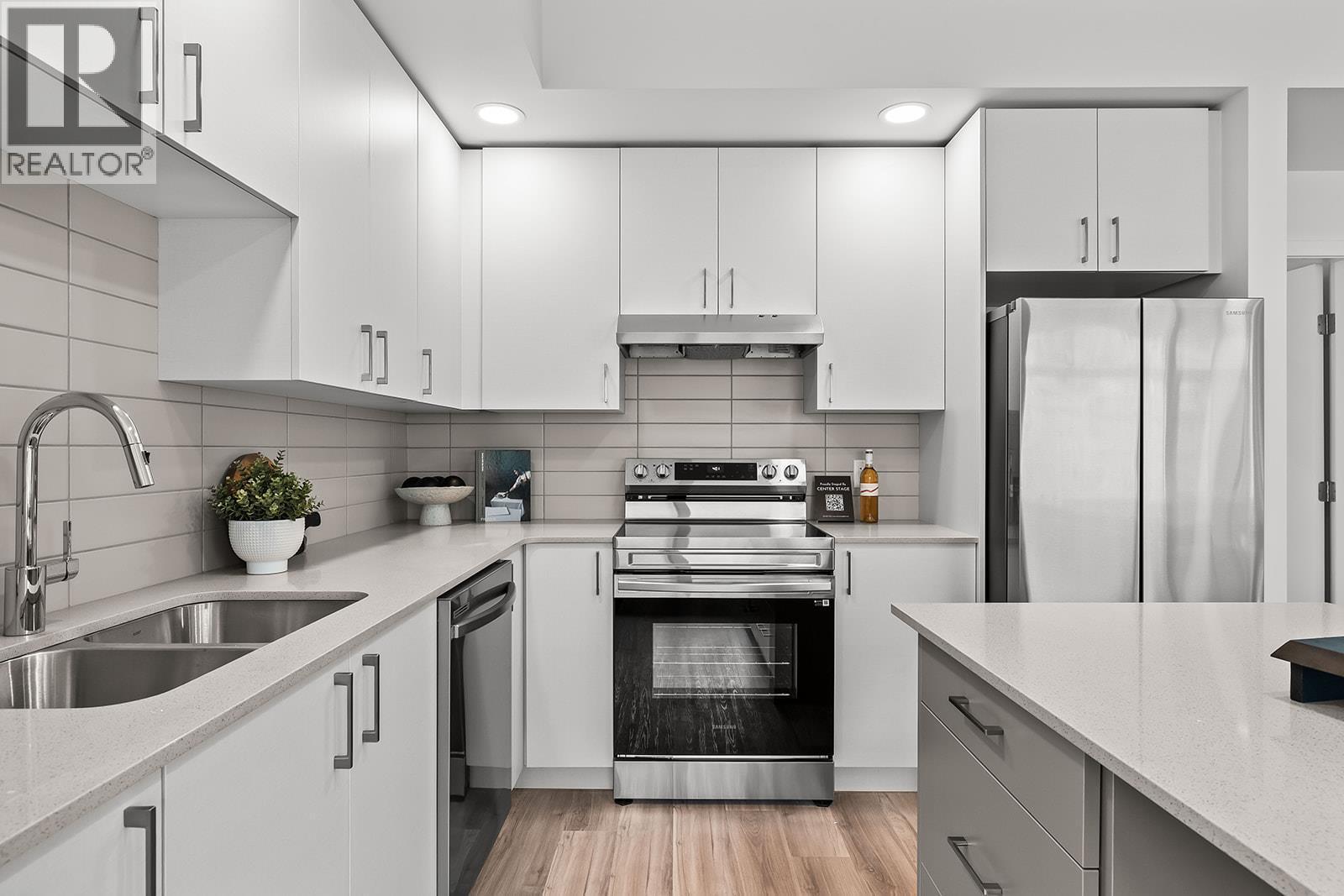 Kitchen. Photos may be of a similar home in the community. - 1057 Frost Road Unit# 418, Kelowna, BC - Indoor Photo Showing Kitchen With Stainless Steel Kitchen With Double Sink With Upgraded Kitchen