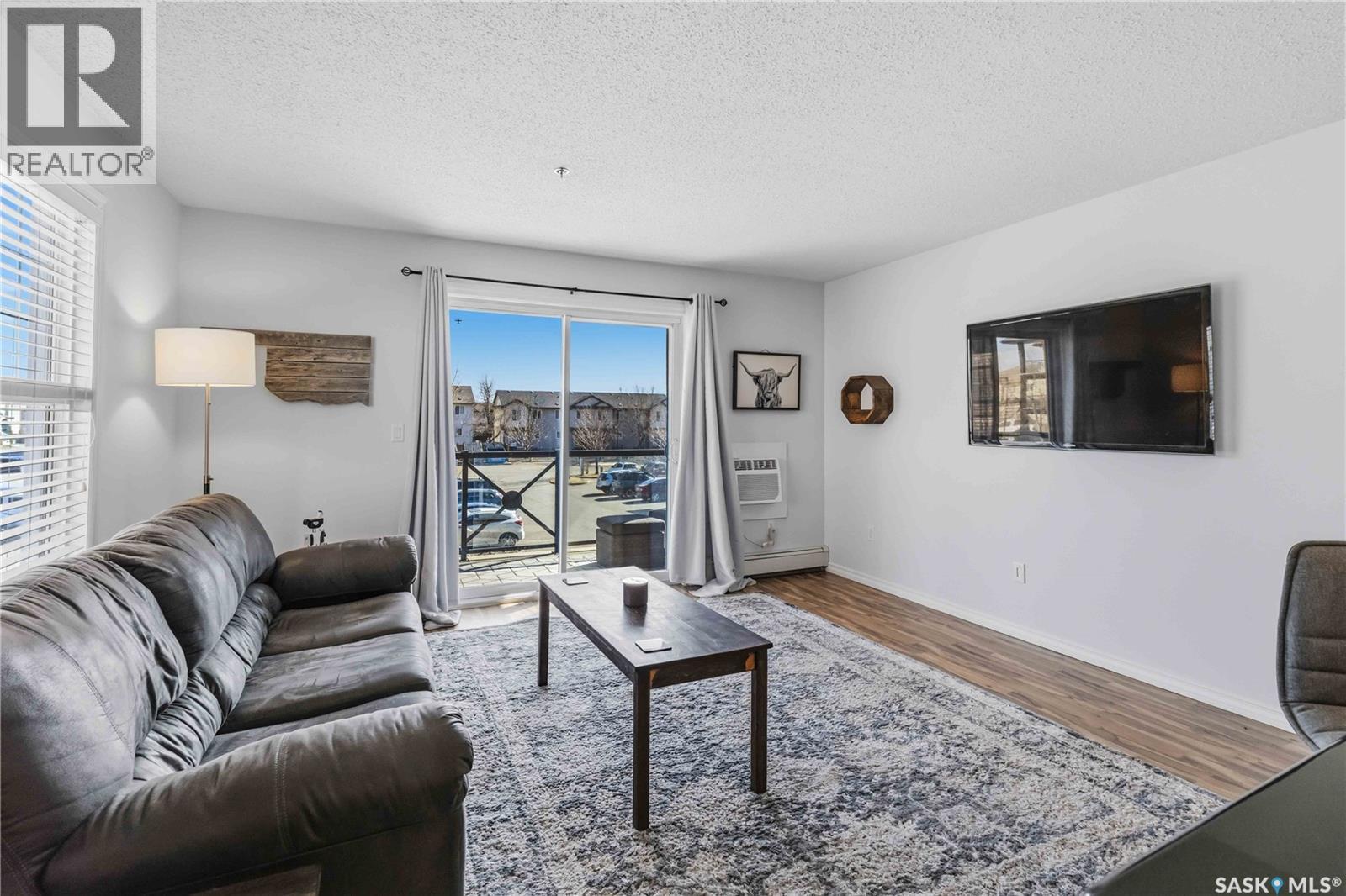 A210 103 Wellman Crescent, Saskatoon, SK - Indoor Photo Showing Living Room