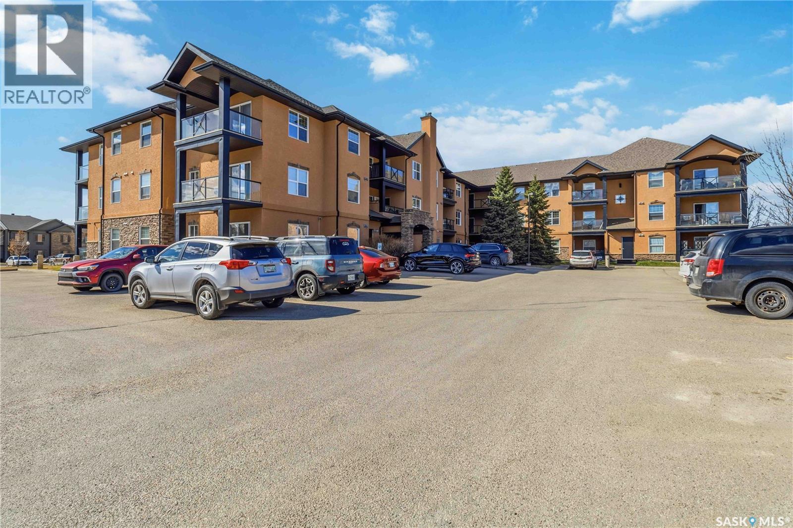 A210 103 Wellman Crescent, Saskatoon, SK - Outdoor With Facade