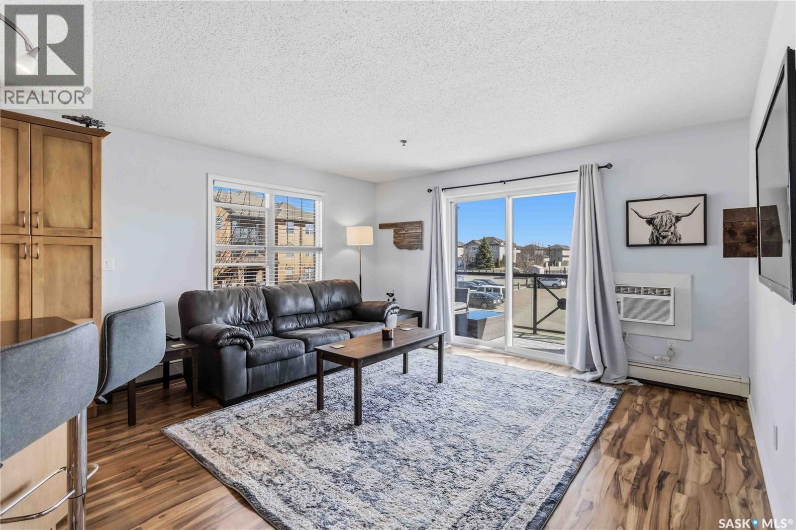A210 103 Wellman Crescent, Saskatoon, SK - Indoor Photo Showing Living Room