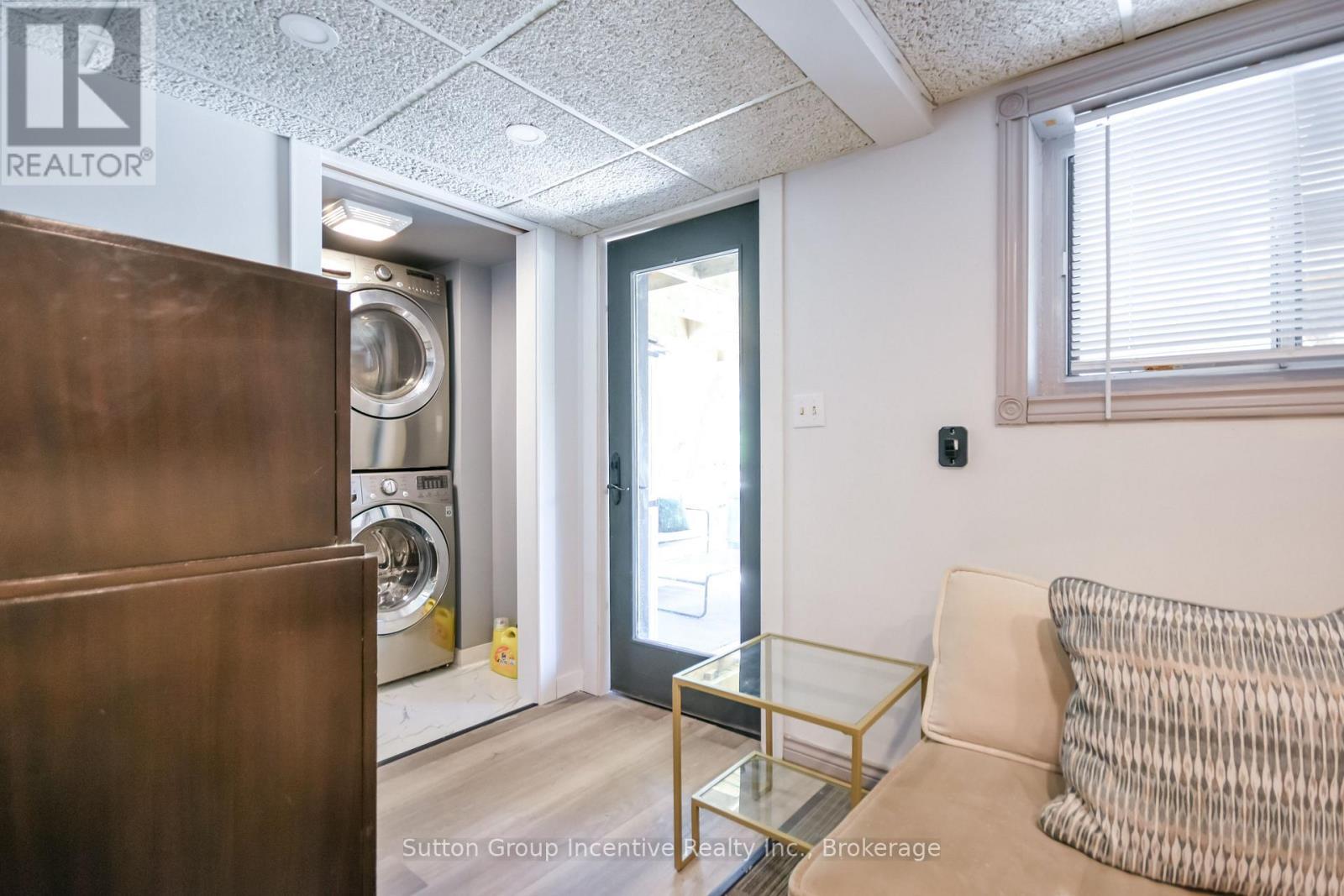 Beach House - Lower Level - Laundry & Walkout - 203 Park Road, Tiny, ON - Indoor Photo Showing Laundry Room