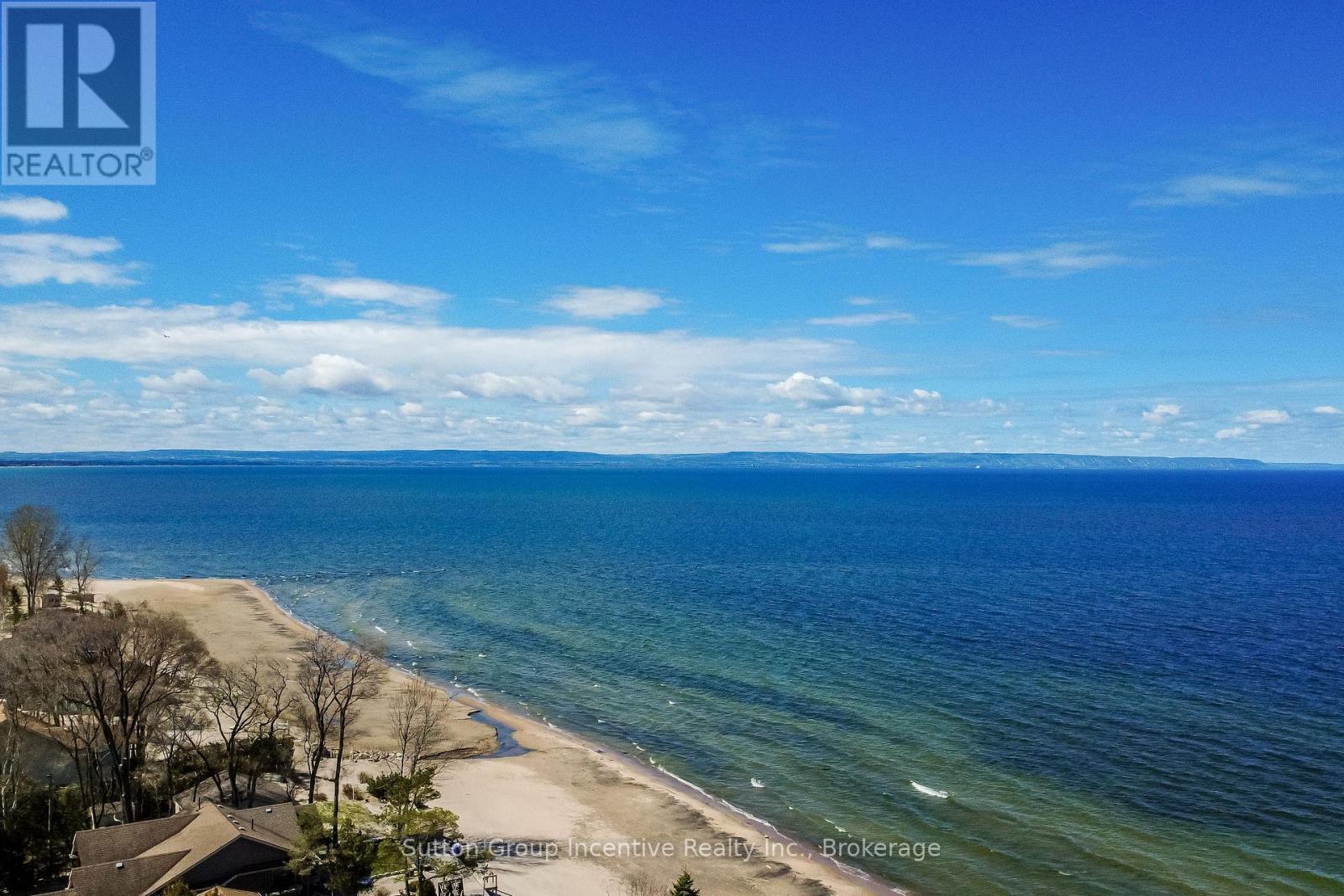 Beach Views Across Georgian Bay to Blue Mountain - 203 Park Road, Tiny, ON - Outdoor With Body Of Water With View