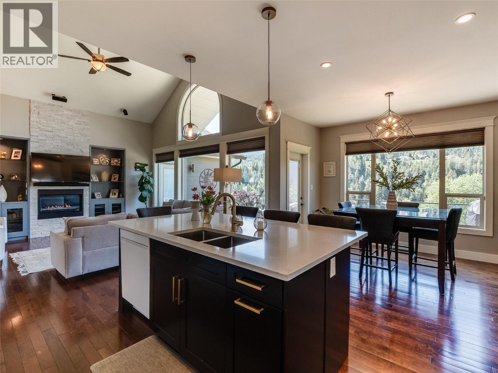 943 Riverview Place, Castlegar, BC - Indoor Photo Showing Kitchen With Fireplace With Double Sink