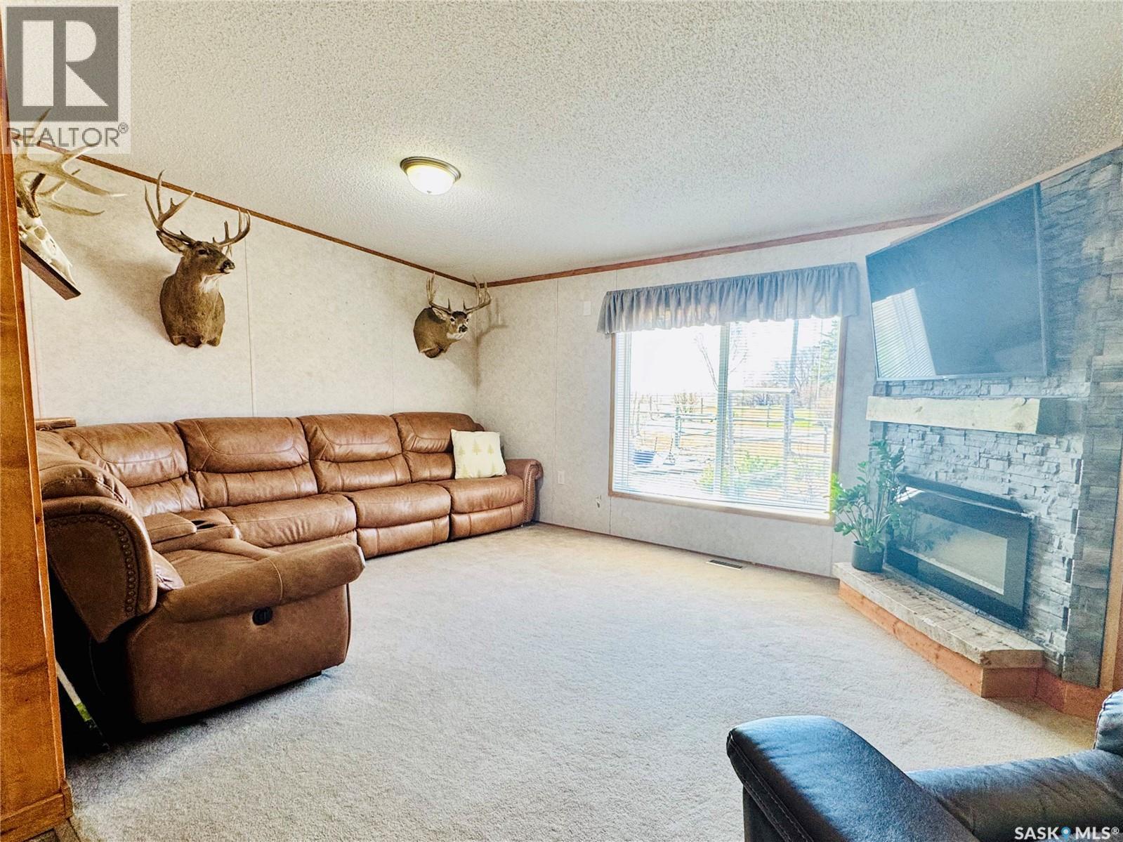 Reiss Acreage, Vibank, SK - Indoor Photo Showing Living Room With Fireplace