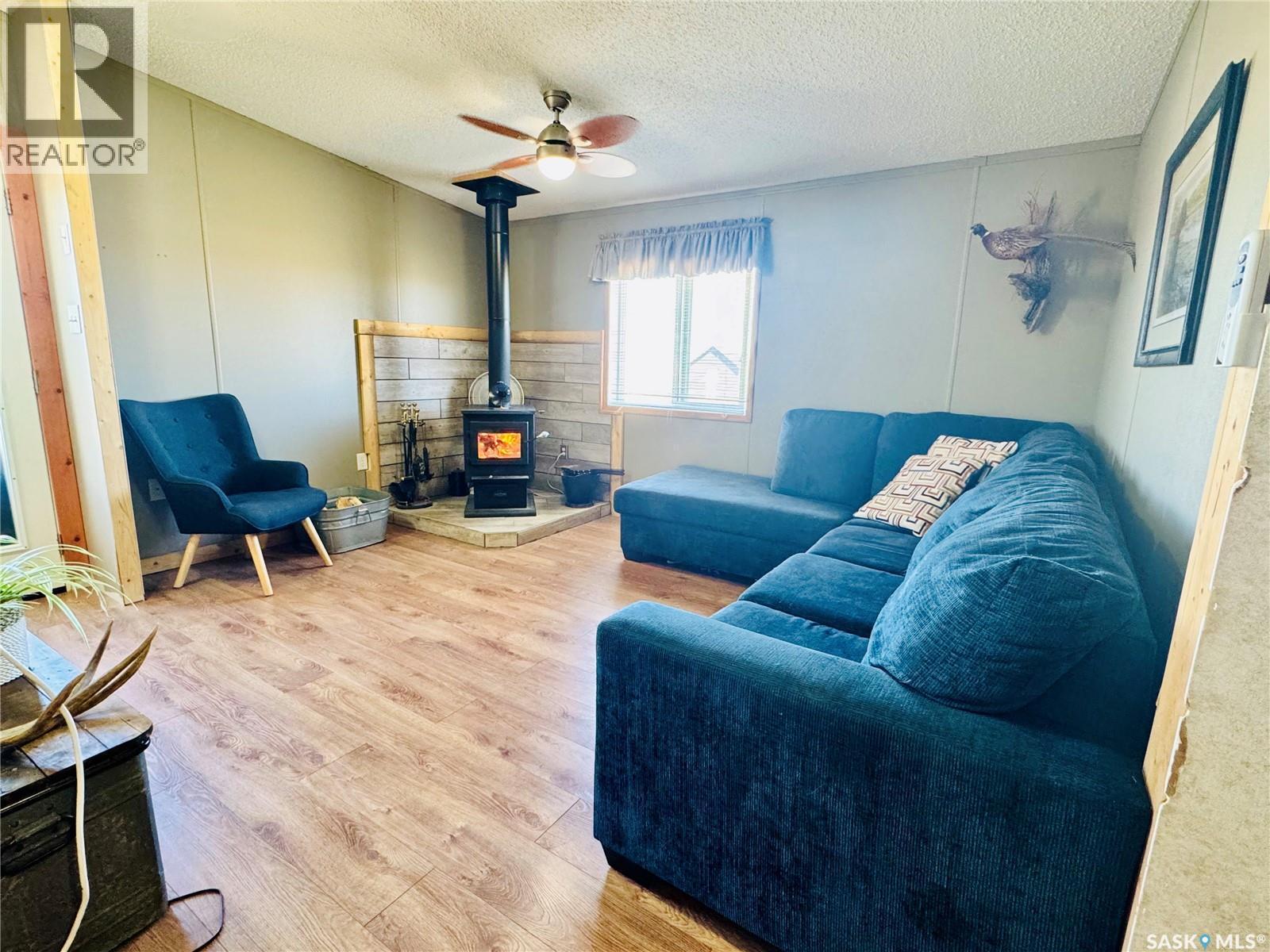 Reiss Acreage, Vibank, SK - Indoor Photo Showing Living Room With Fireplace