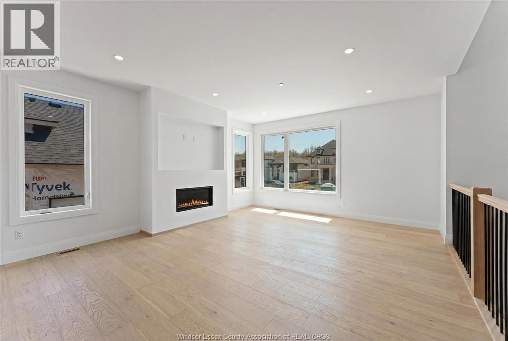 8312 Annie, Mcgregor, ON - Indoor Photo Showing Living Room With Fireplace