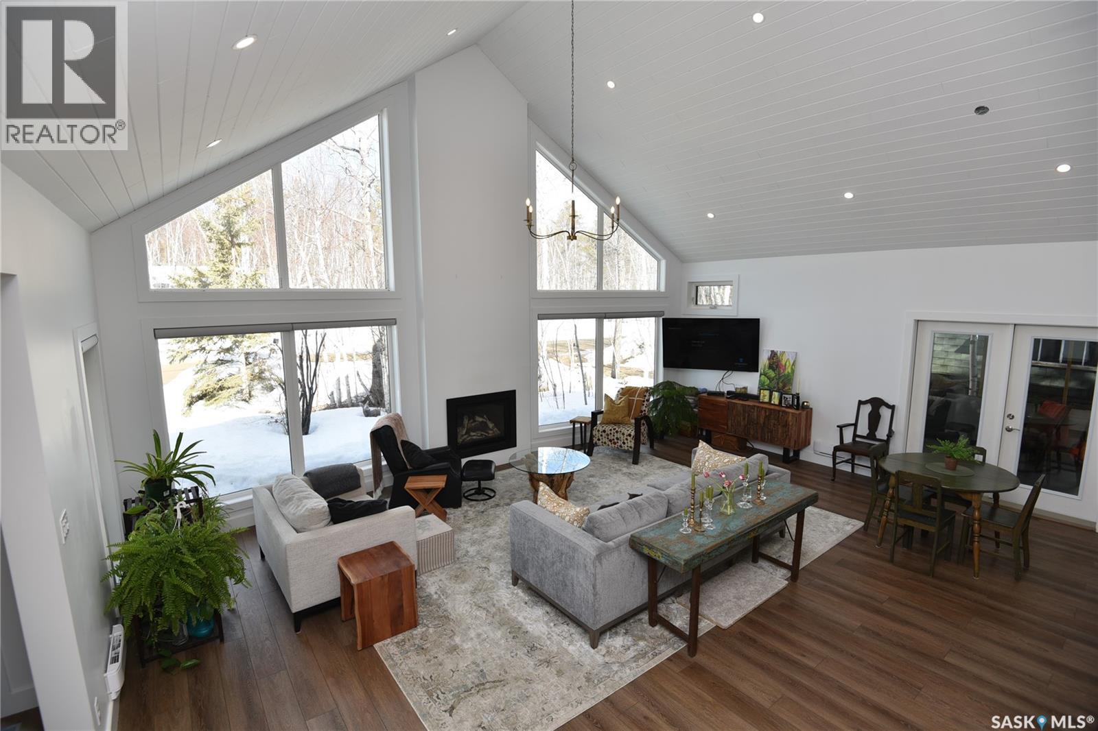 213 Birch Avenue, Tobin Lake, SK - Indoor Photo Showing Living Room With Fireplace