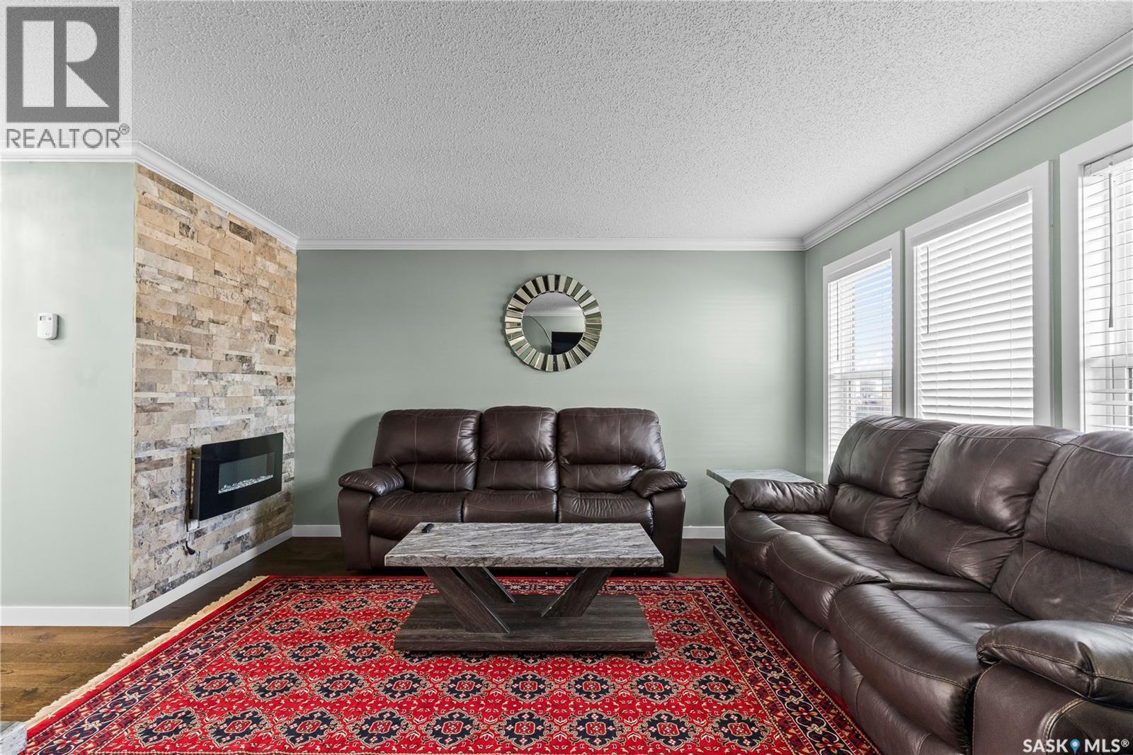 68 235 Rosewood Boulevard E, Saskatoon, SK - Indoor Photo Showing Living Room With Fireplace
