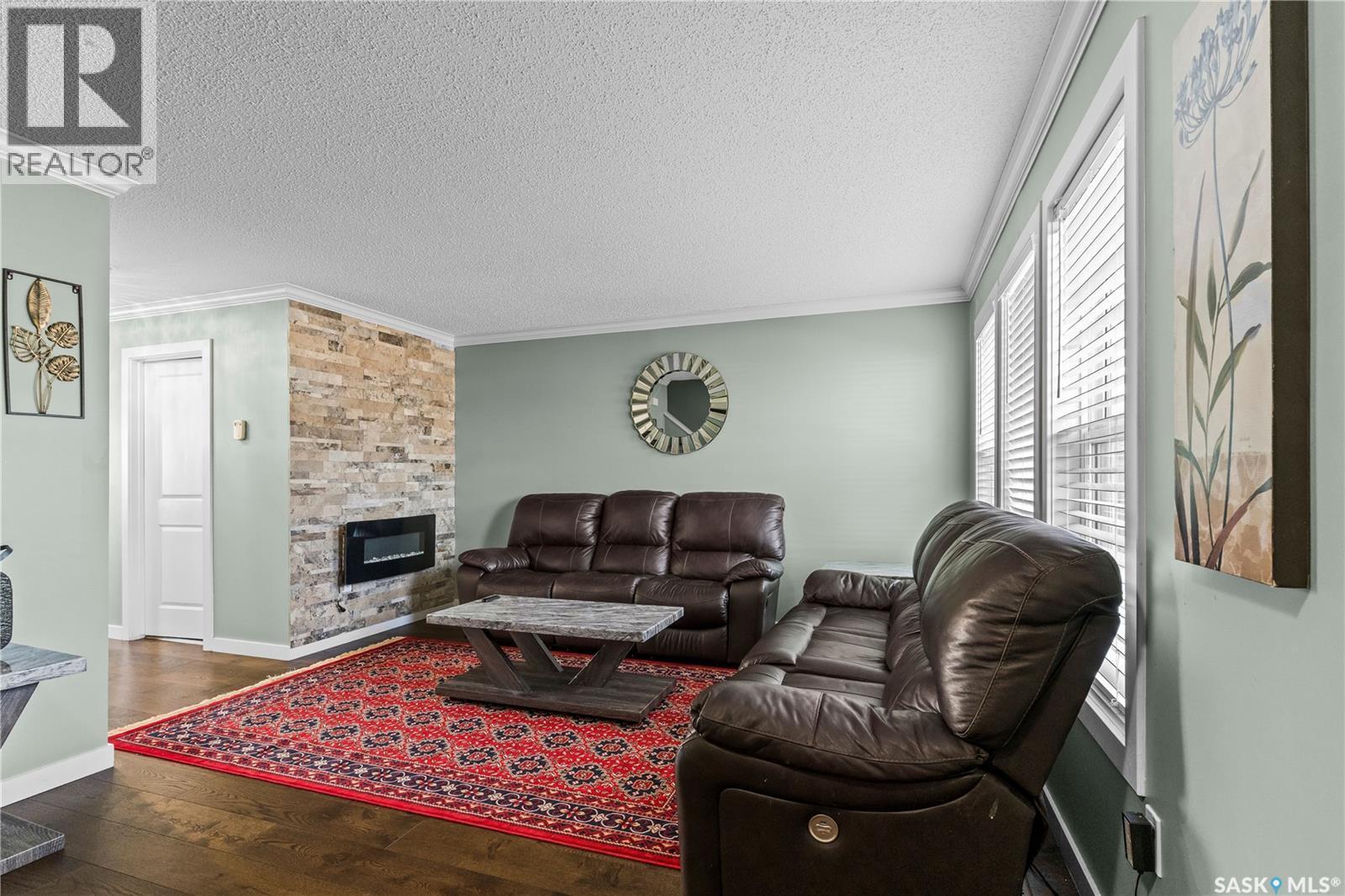 68 235 Rosewood Boulevard E, Saskatoon, SK - Indoor Photo Showing Living Room With Fireplace