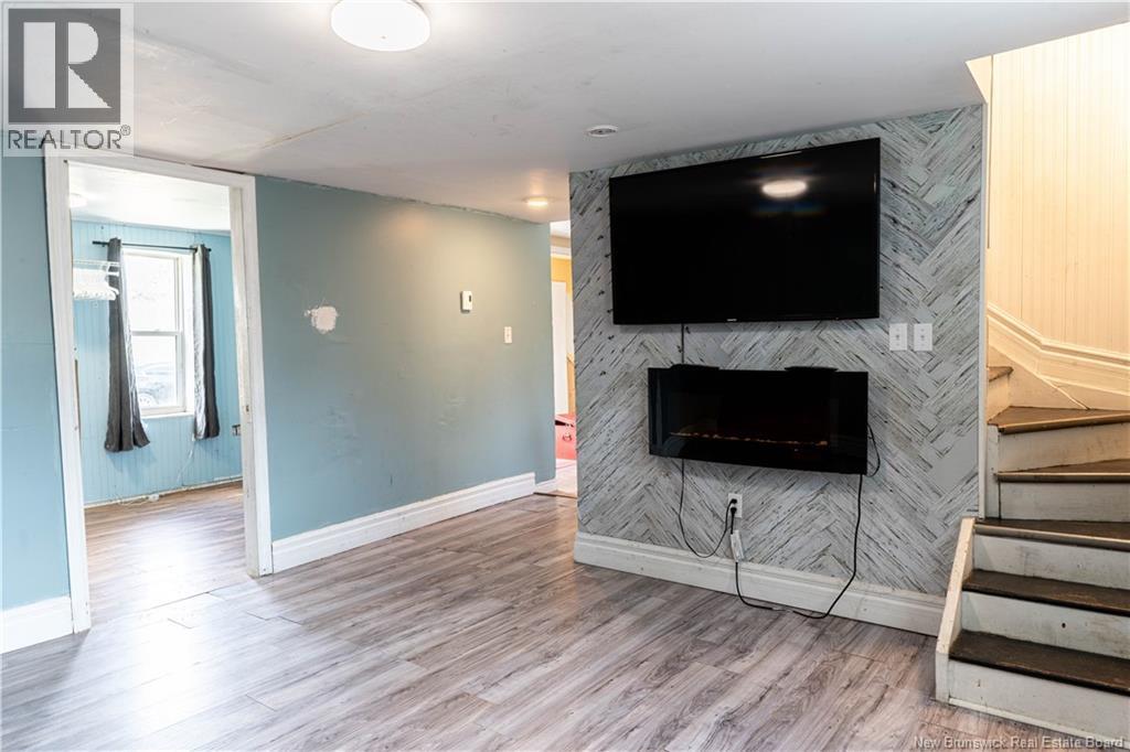 25 Station St, Blackville, NB - Indoor Photo Showing Living Room With Fireplace