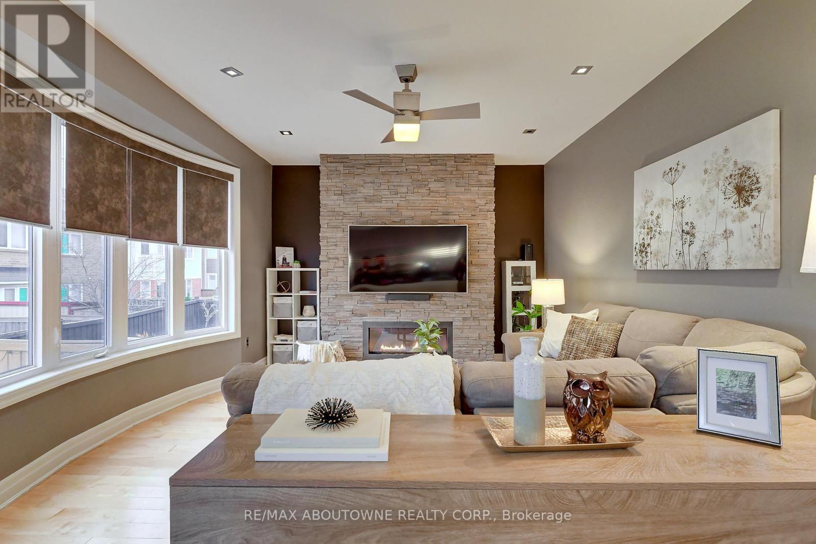 310 Leitch Landing, Milton, ON - Indoor Photo Showing Living Room With Fireplace