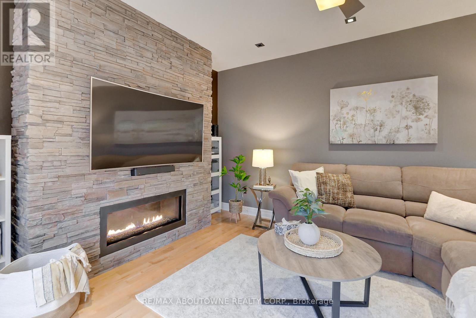 310 Leitch Landing, Milton, ON - Indoor Photo Showing Living Room With Fireplace