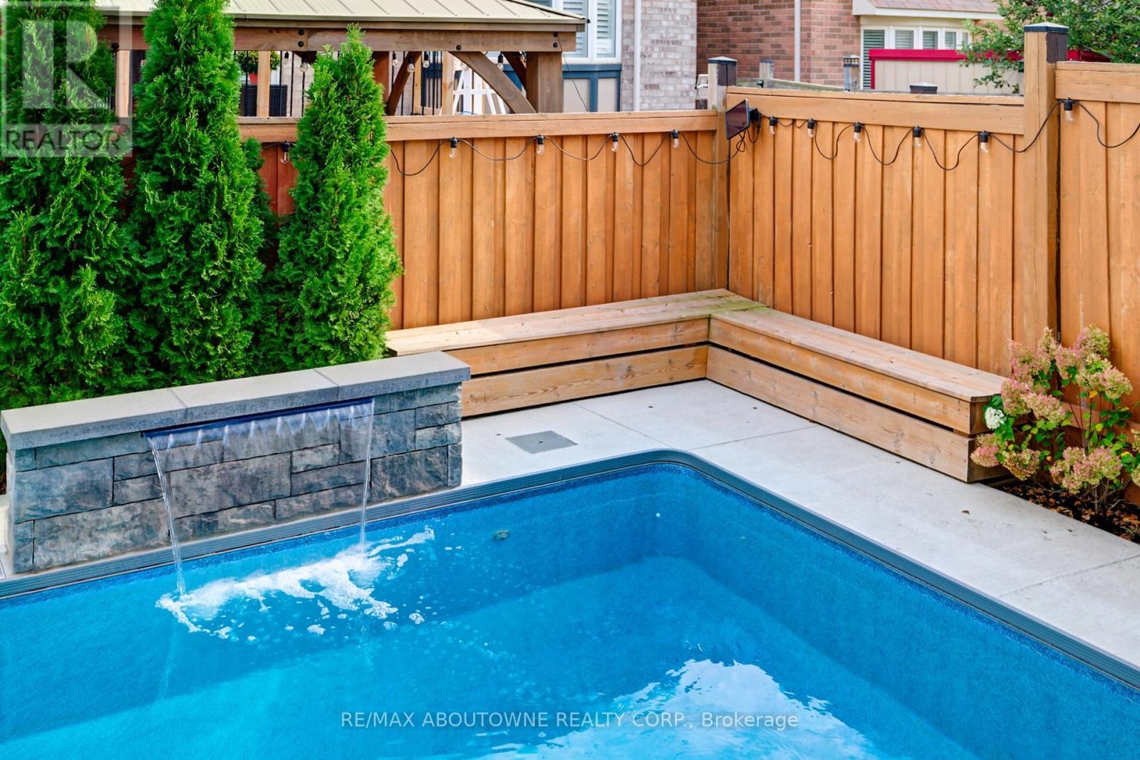 310 Leitch Landing, Milton, ON - Outdoor With In Ground Pool