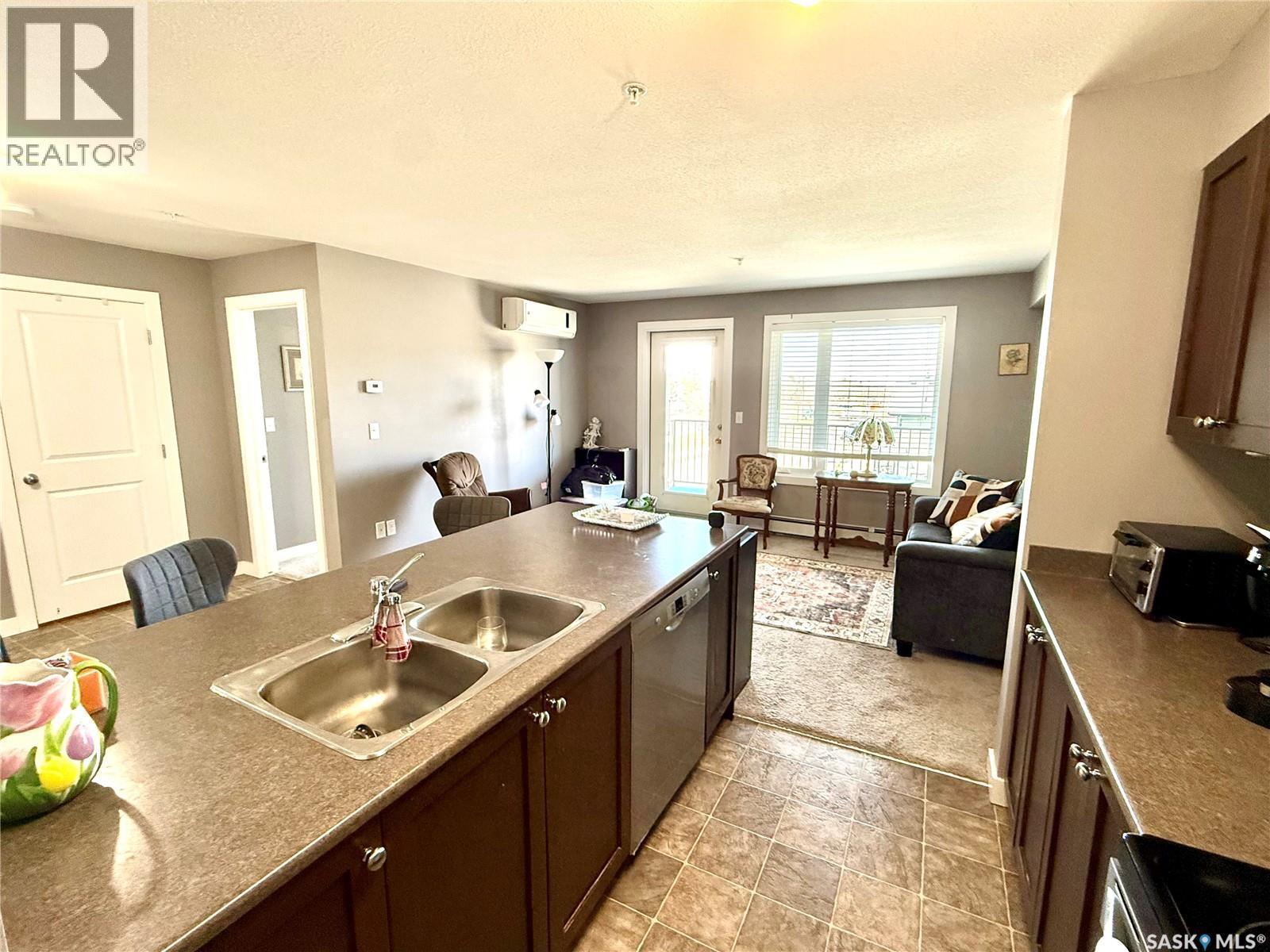 302 820 5Th Street Ne, Weyburn, SK - Indoor Photo Showing Kitchen With Double Sink