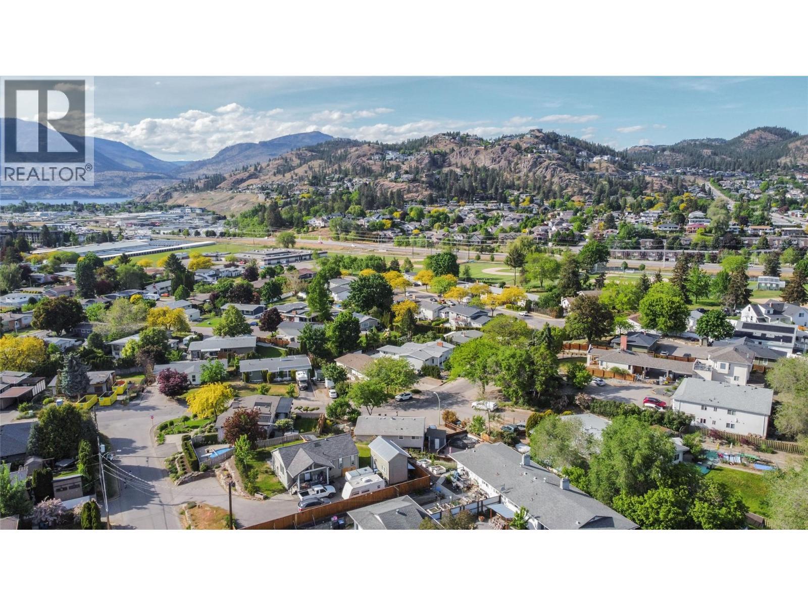 Easy biking/walking access to green space - 1385 Orchard Drive, Kelowna, BC - Outdoor With View