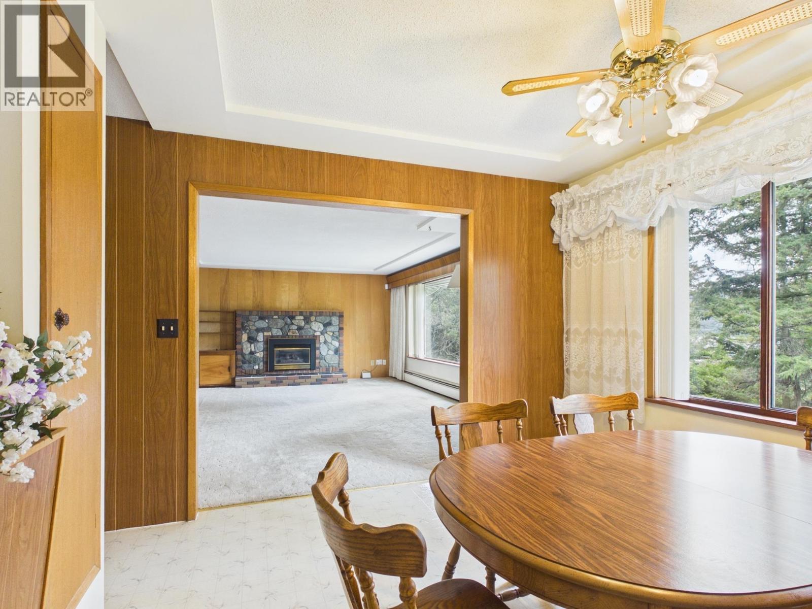 2038 White Road, Williams Lake, BC - Indoor Photo Showing Dining Room With Fireplace