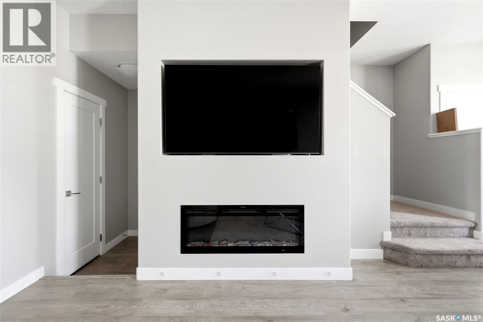 4217 E Keller Avenue, Regina, SK - Indoor Photo Showing Living Room With Fireplace