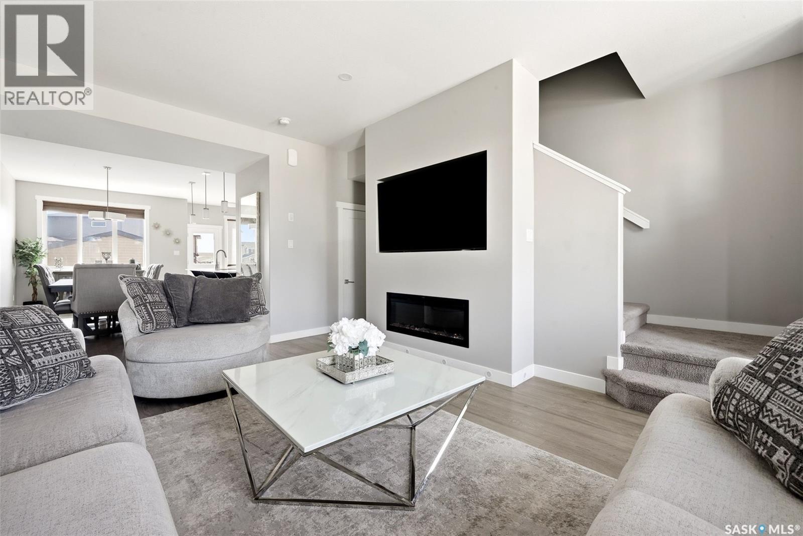 4217 E Keller Avenue, Regina, SK - Indoor Photo Showing Living Room With Fireplace