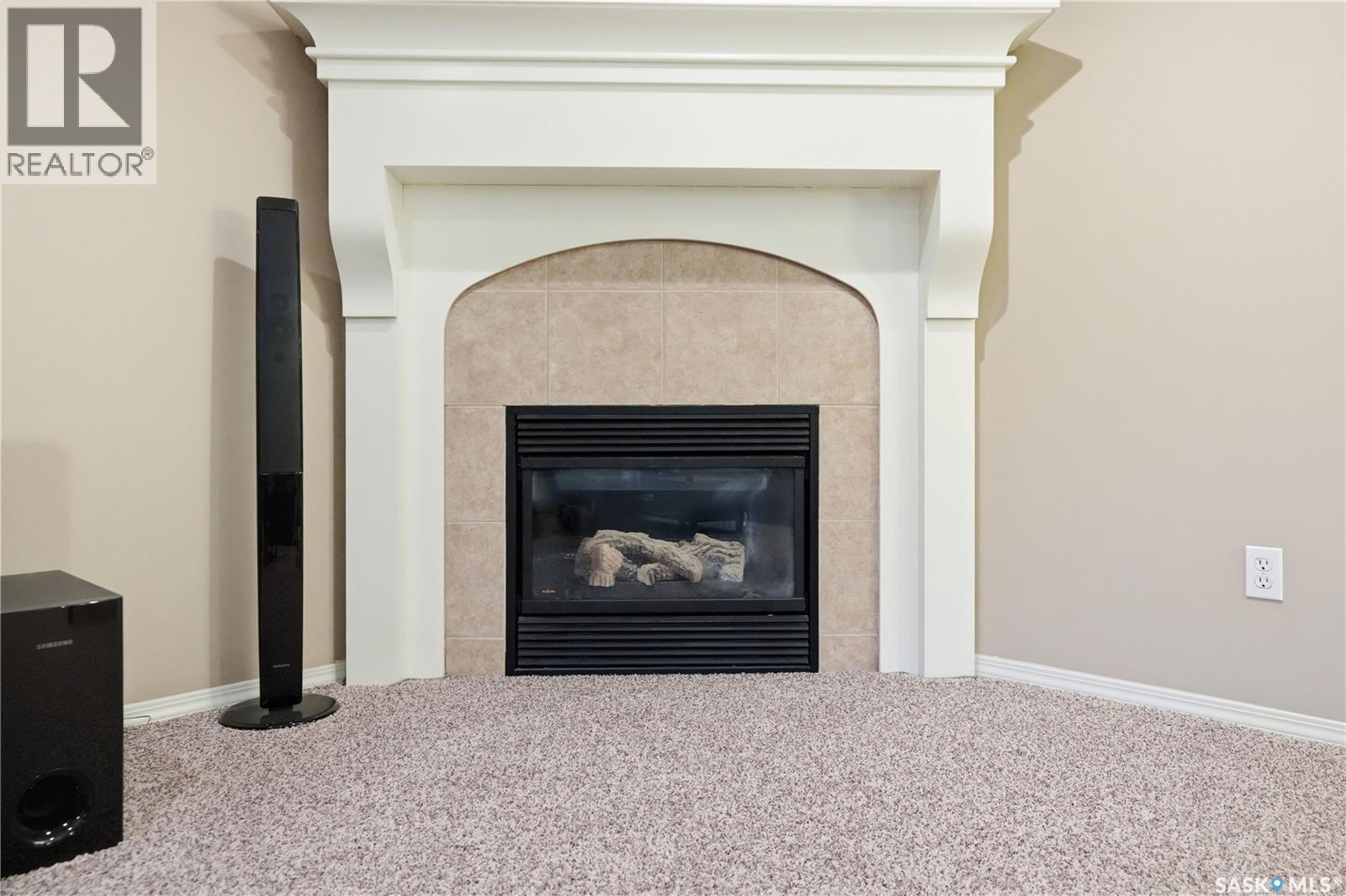 1642 Wingert Drive, Regina, SK - Indoor Photo Showing Living Room With Fireplace