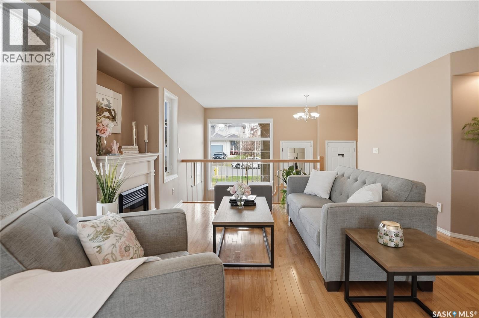 1642 Wingert Drive, Regina, SK - Indoor Photo Showing Living Room With Fireplace