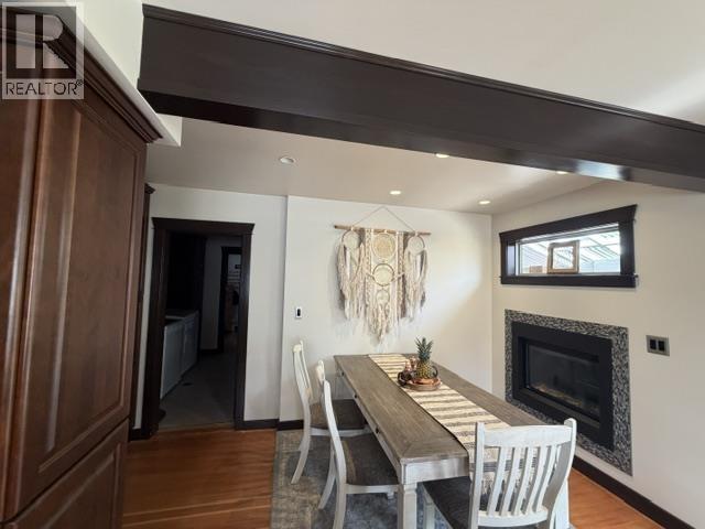 7264 Eugene Road, Prince George, BC - Indoor Photo Showing Dining Room With Fireplace