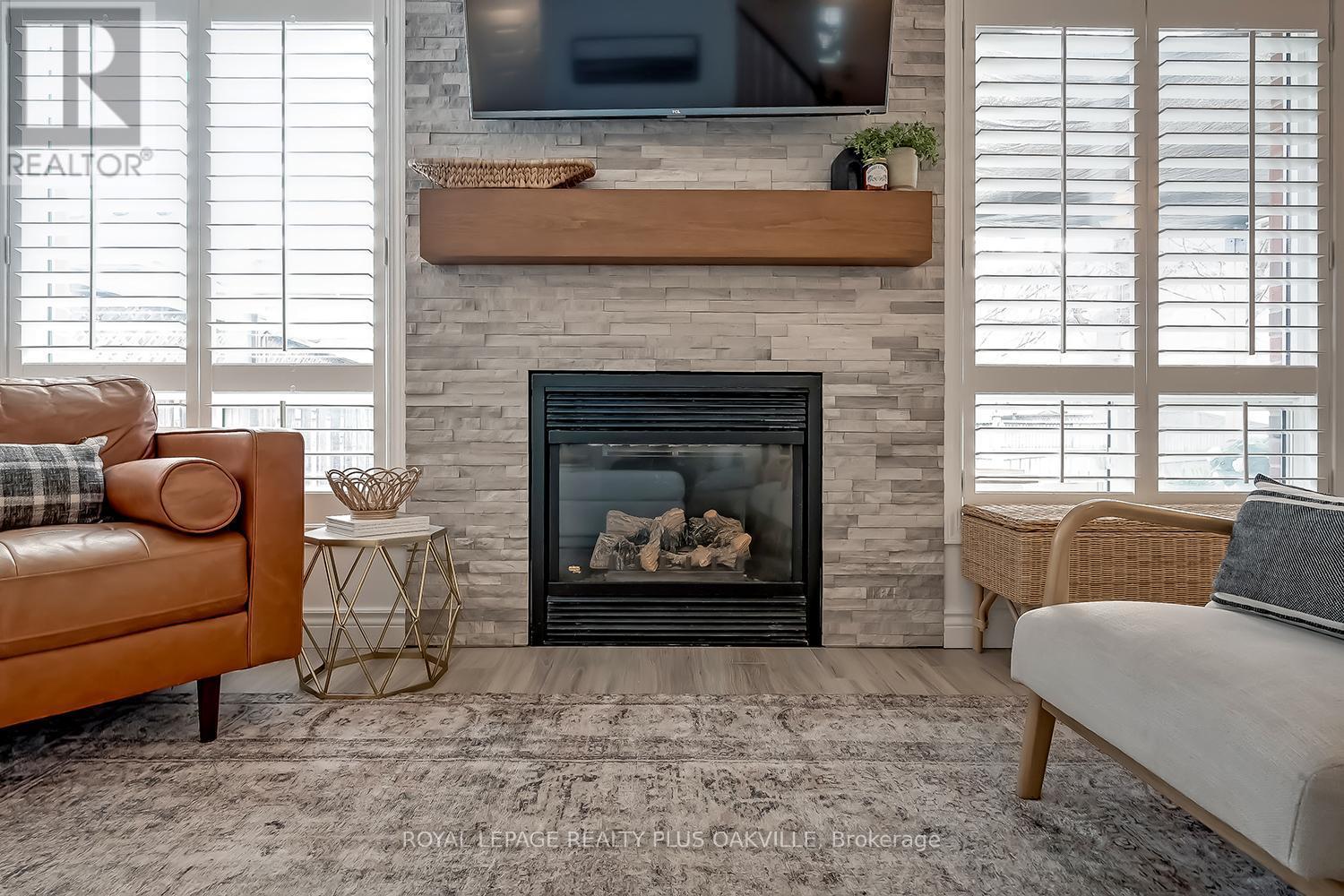 1159 Barclay Circle, Milton, ON - Indoor Photo Showing Living Room With Fireplace