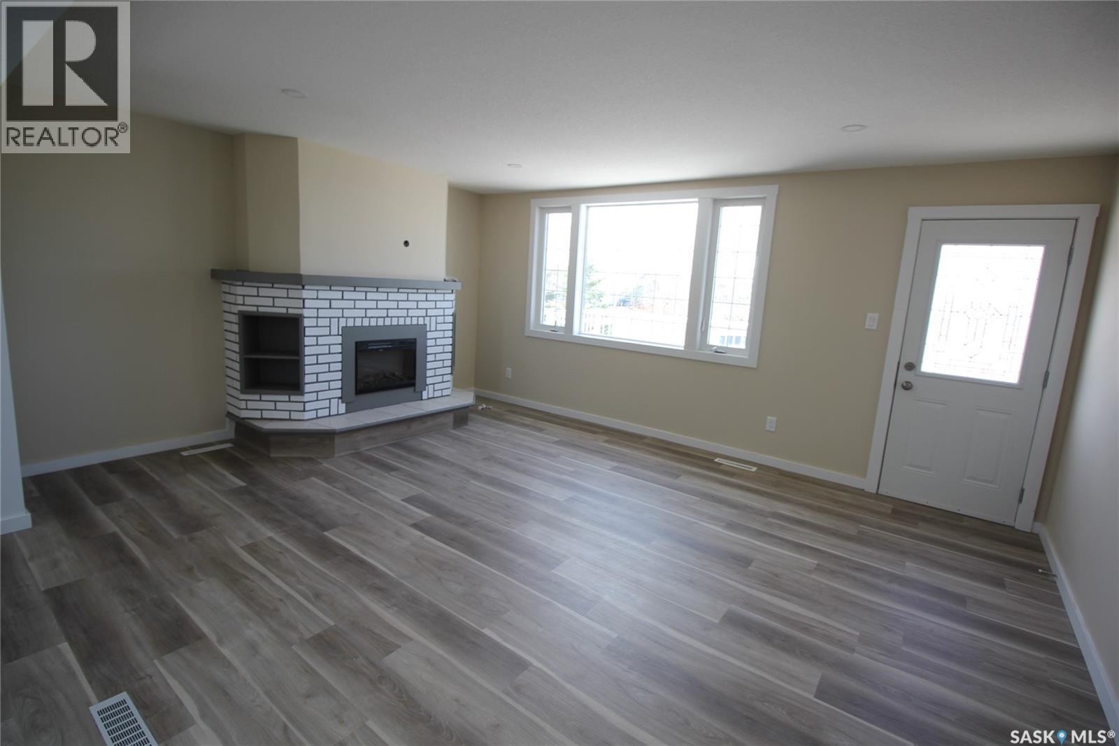 10 Louise Crescent, Katepwa Beach, SK - Indoor Photo Showing Living Room With Fireplace