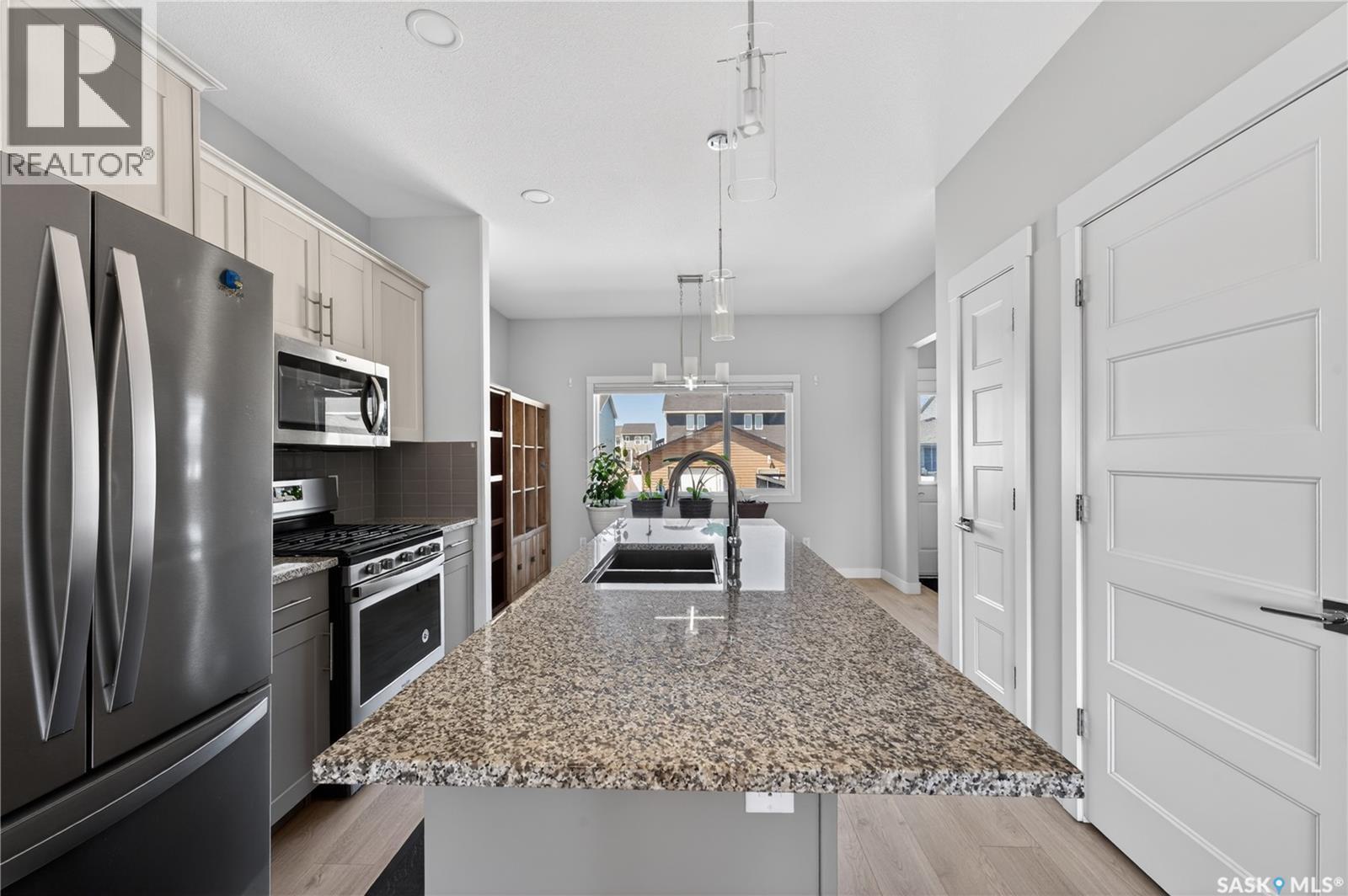 3136 Crosbie Crescent, Regina, SK - Indoor Photo Showing Kitchen With Stainless Steel Kitchen With Double Sink With Upgraded Kitchen