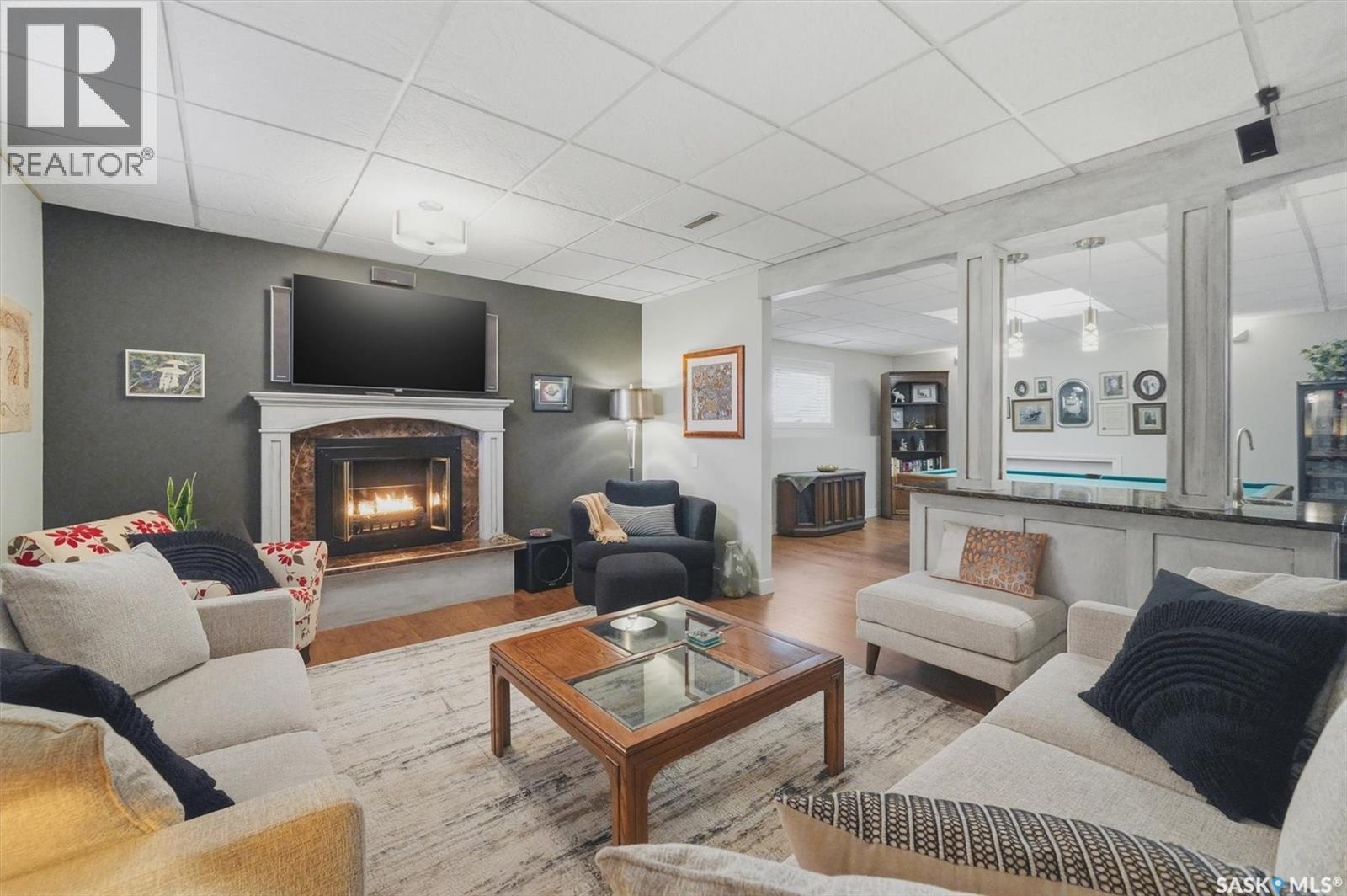 203 Gustin Crescent, Saskatoon, SK - Indoor Photo Showing Living Room With Fireplace