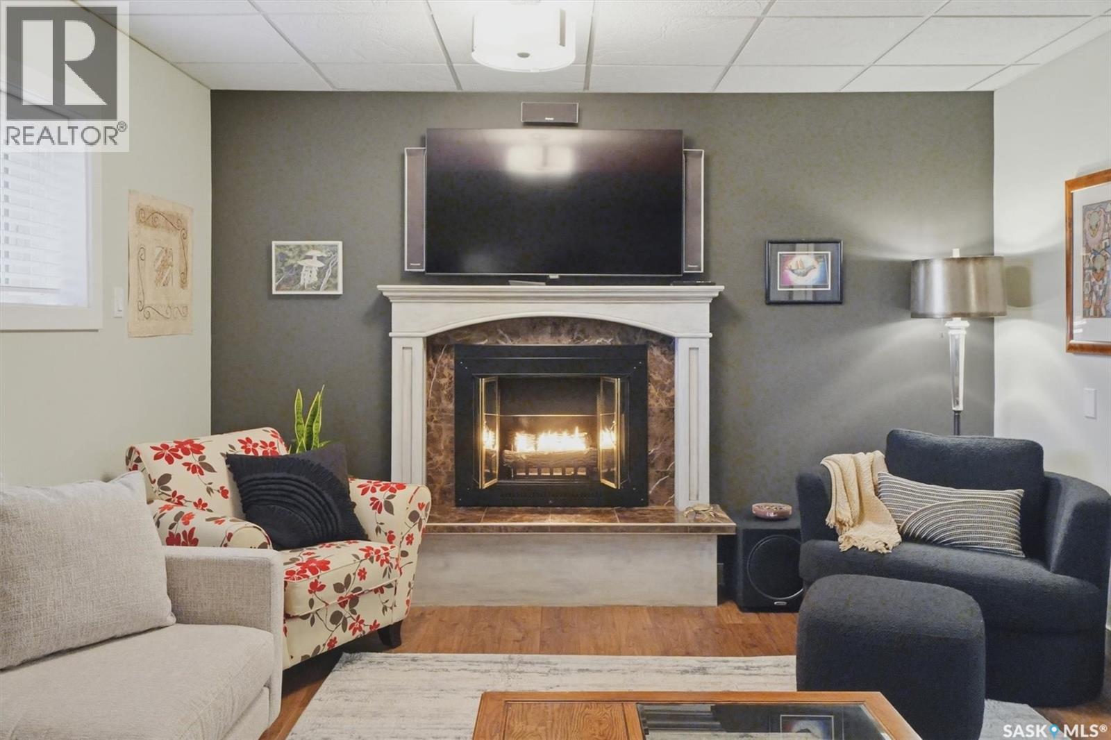 203 Gustin Crescent, Saskatoon, SK - Indoor Photo Showing Living Room With Fireplace