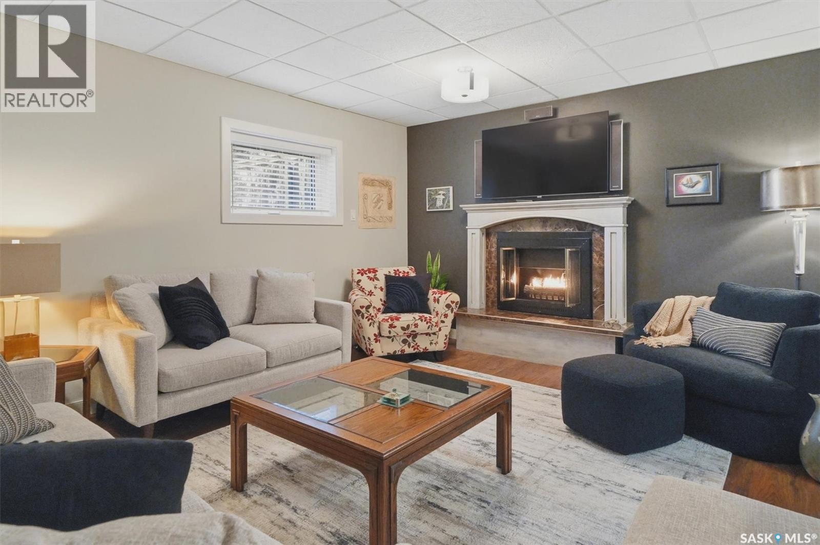 203 Gustin Crescent, Saskatoon, SK - Indoor Photo Showing Living Room With Fireplace