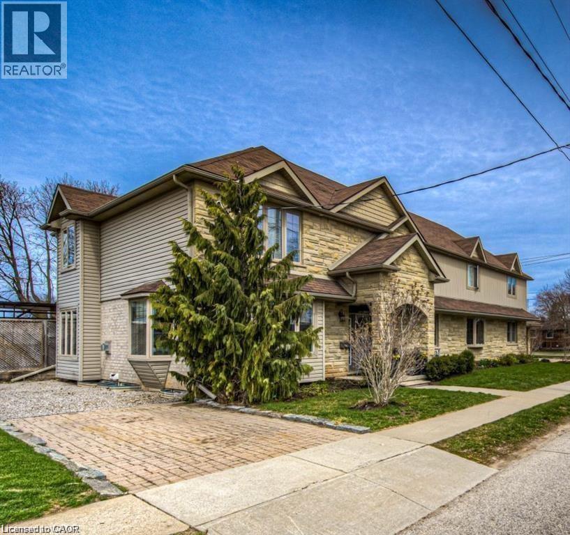 Multi-level residential property with stone and siding exterior - 716 Westminster Drive S Unit# Lower, Cambridge, ON - Outdoor With Facade