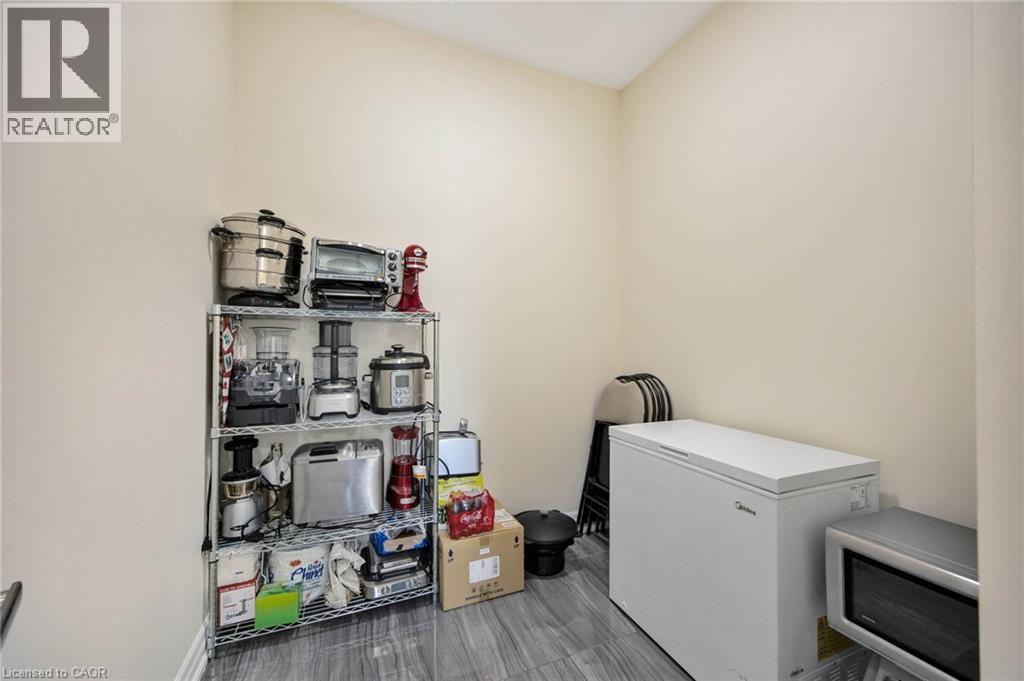 Light-toned walls complement the gray tile flooring in this room - 6 Dorothys Drive, Oro-Medonte, ON - Indoor Photo Showing Laundry Room