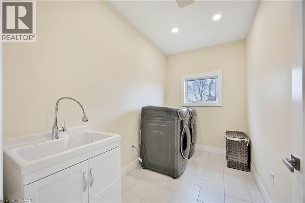 Laundry room featuring light-toned walls, recessed lighting, and tile flooring - 6 Dorothys Drive, Oro-Medonte, ON - Indoor Photo Showing Laundry Room