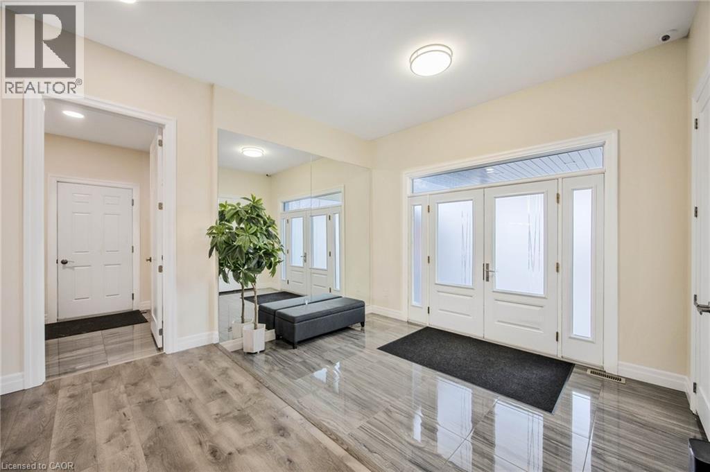 Entryway featuring a double door with frosted glass panels, two sidelights, and a transom window - 6 Dorothys Drive, Oro-Medonte, ON - Indoor