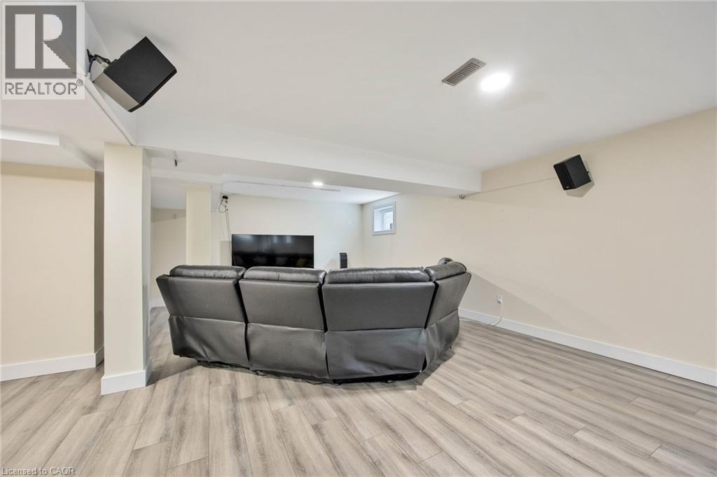 Finished basement area featuring plank flooring, recessed lighting, and integrated wall-mounted speakers - 6 Dorothys Drive, Oro-Medonte, ON - Indoor